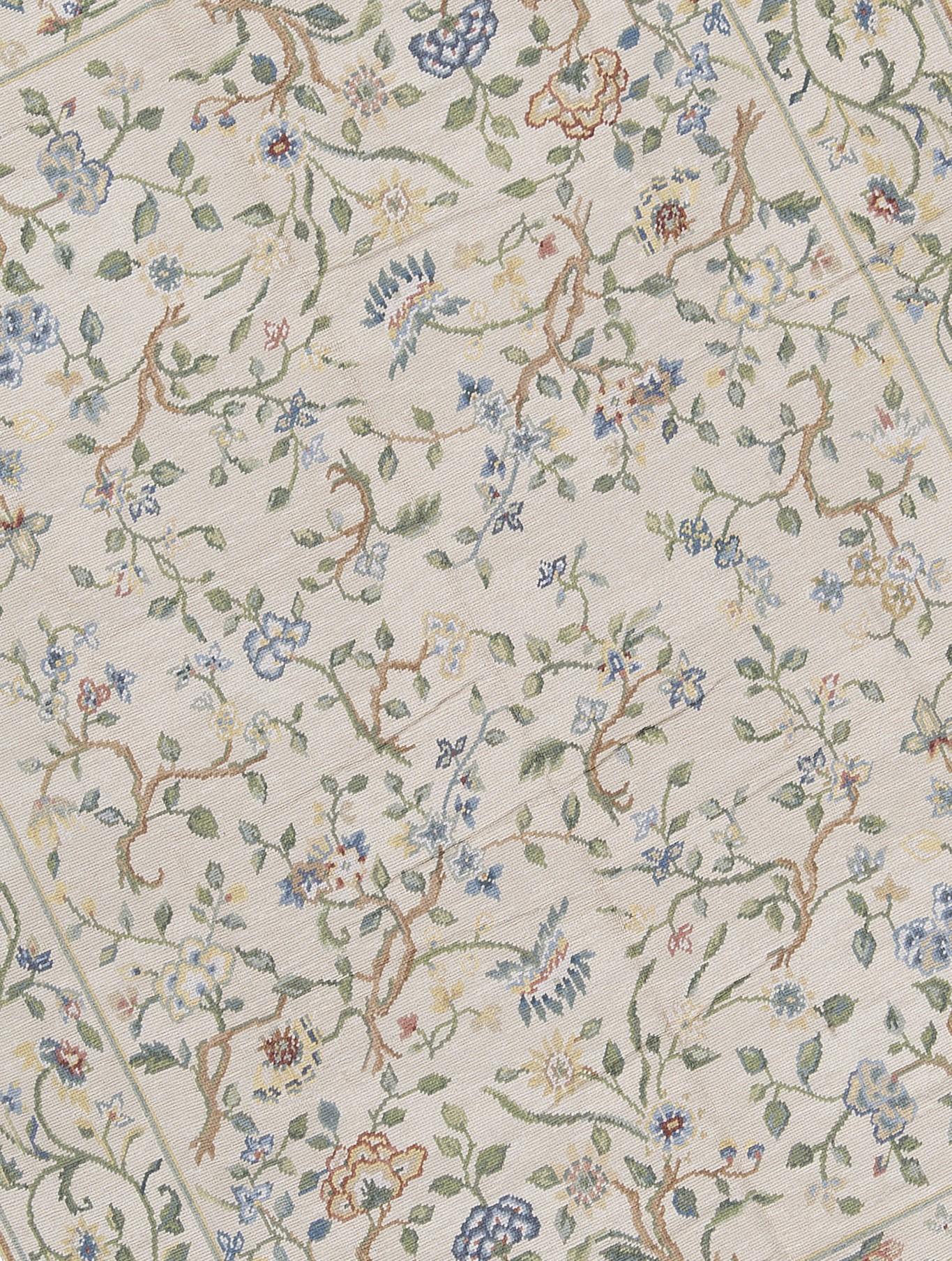 Inspired by the Tuscan countryside, caramel branches with olive green leaves and flowers in navy, powder blue, pale and golden yellows, are surrounded by a vine and flower border that rests on an variegated egg shell and oatmeal, beige ground. Size