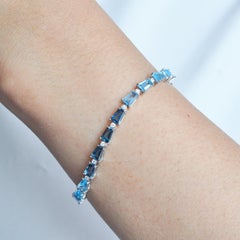 5.50 MM Blue Topaz Taper Baguette Calibre Cut Diamond Chic Tennis Bracelet