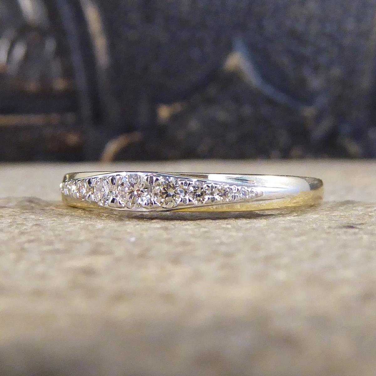 This ring is new and never worn, it is set with 9 Diamonds in a claw setting, graduating from the smallest on the outside leading to meet in the middle being the largest stone. Such a lovely little ring that shows great quality in the stones in a