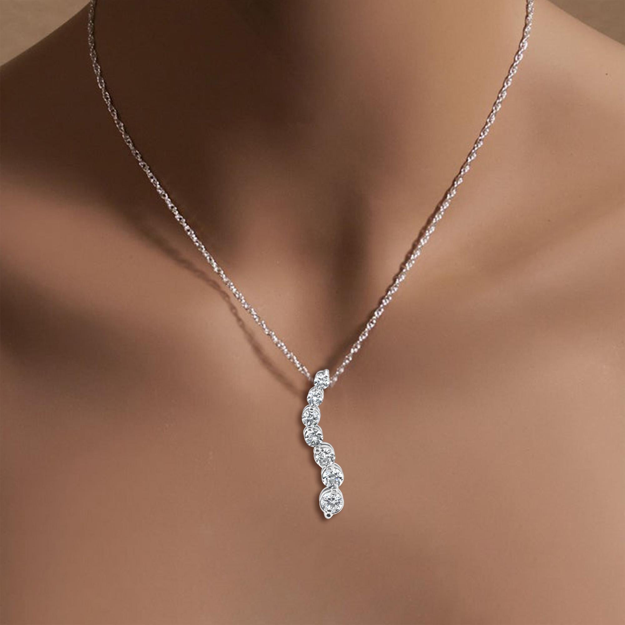 ♥ Product Summary ♥

Main Stone: Diamonds
Approx. Carat Weight: 1.53cttw
Diamond Cut: Round
Number of Stones: 7
Metal Choice: 14K White Gold
Dimensions: 30mm x 5mm 
Weight: 2 grams
Chain: 16