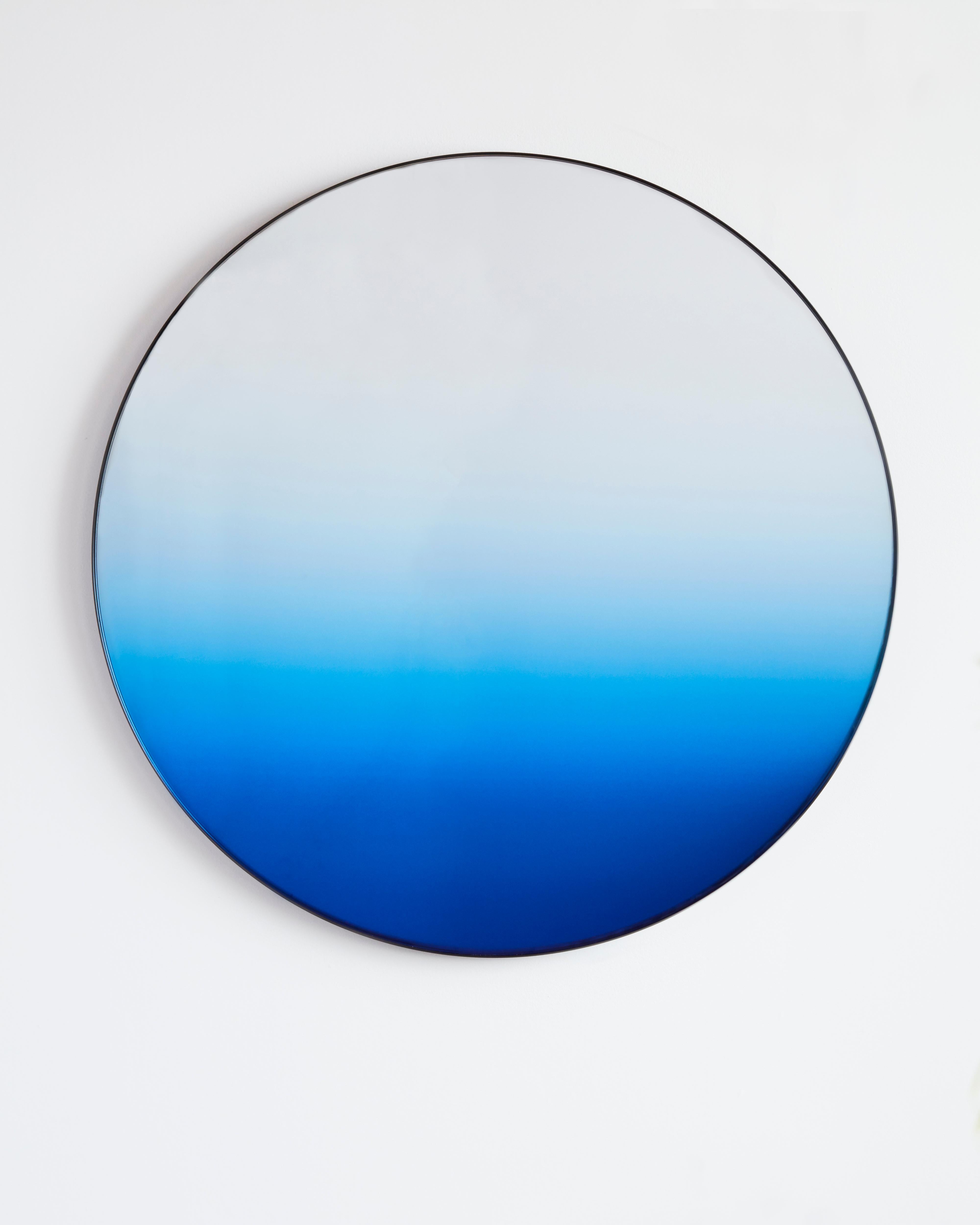 Gradient mirror by Phillip Jividen
Dimensions: D 66 cm
Materials: Glass, Aluminum
Other dimensions available. 

Inspired by the earth’s sky the Gradient Mirror is a minimalist design that integrates color into a mirror surface to create an