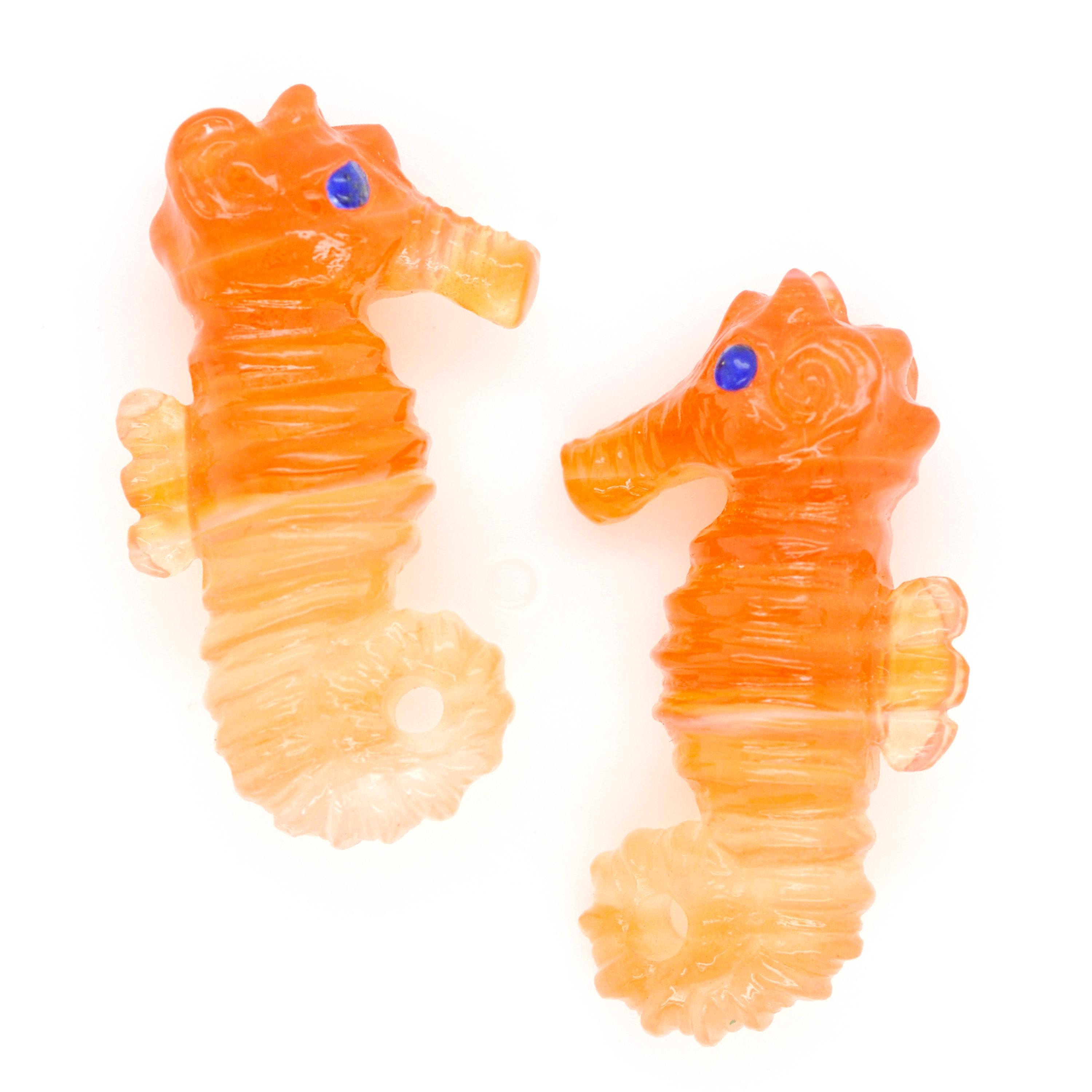 This seahorse carving on natural carnelian is hand-carved with extreme detail by our expert lapidary artist in Jaipur which transforms raw stones into unique art works. The carving is absolutely detailed and so beautiful that when adorned in a pair
