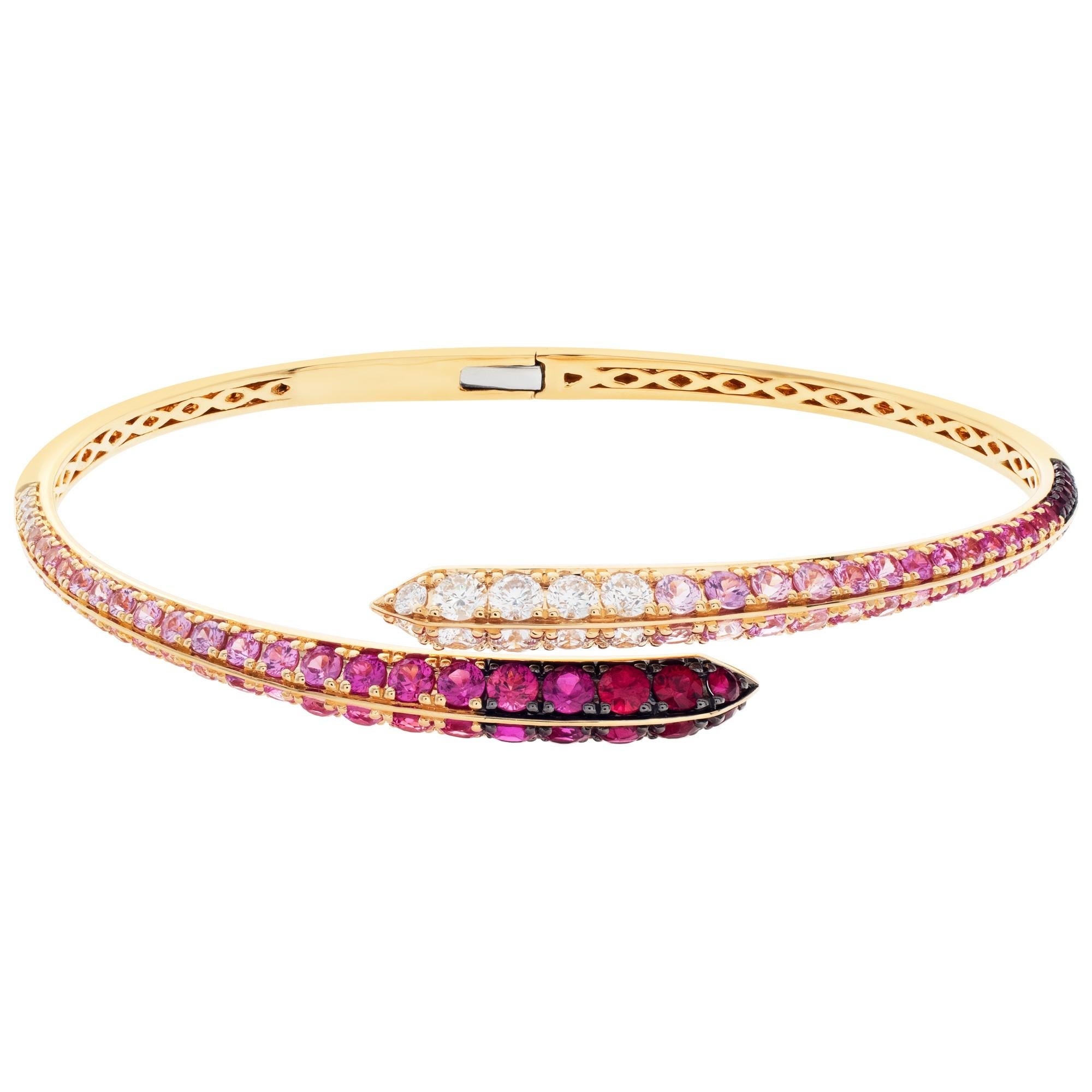 ESTIMATED RETAIL: $10,260.00
YOUR PRICE: $7,392.00

Gorgeous bangle with diamonds, rubies & pink sapphires set in 18K gold. Diamonds approx. total weight: 0.86 carat. 
Graduated hues of pink sapphire, total approx. weight: 3.10 carats
Rubies total