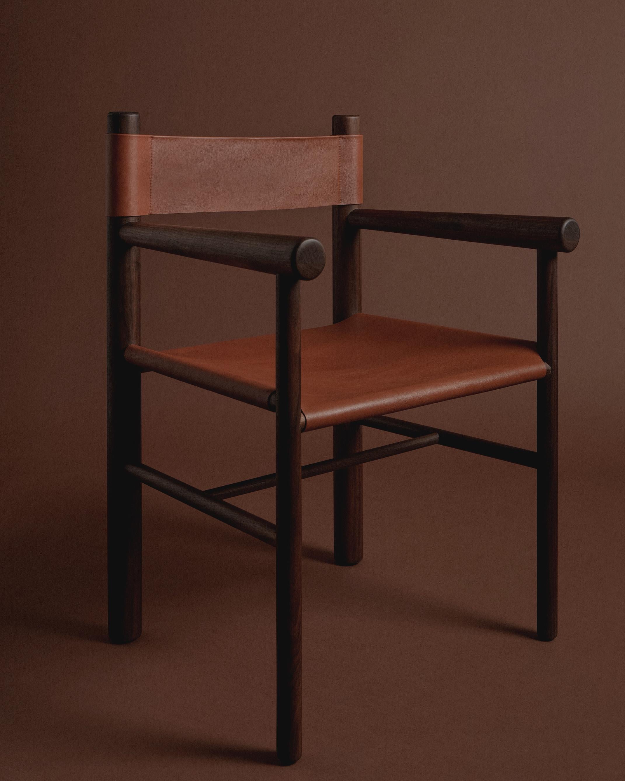 Inspired by utilitarian furniture, the Gradual Chair plays with the proportions of different size turned wood parts. The front and back legs are different diameters, and the arms taper forward, declining gradually to join the thicker back legs,
