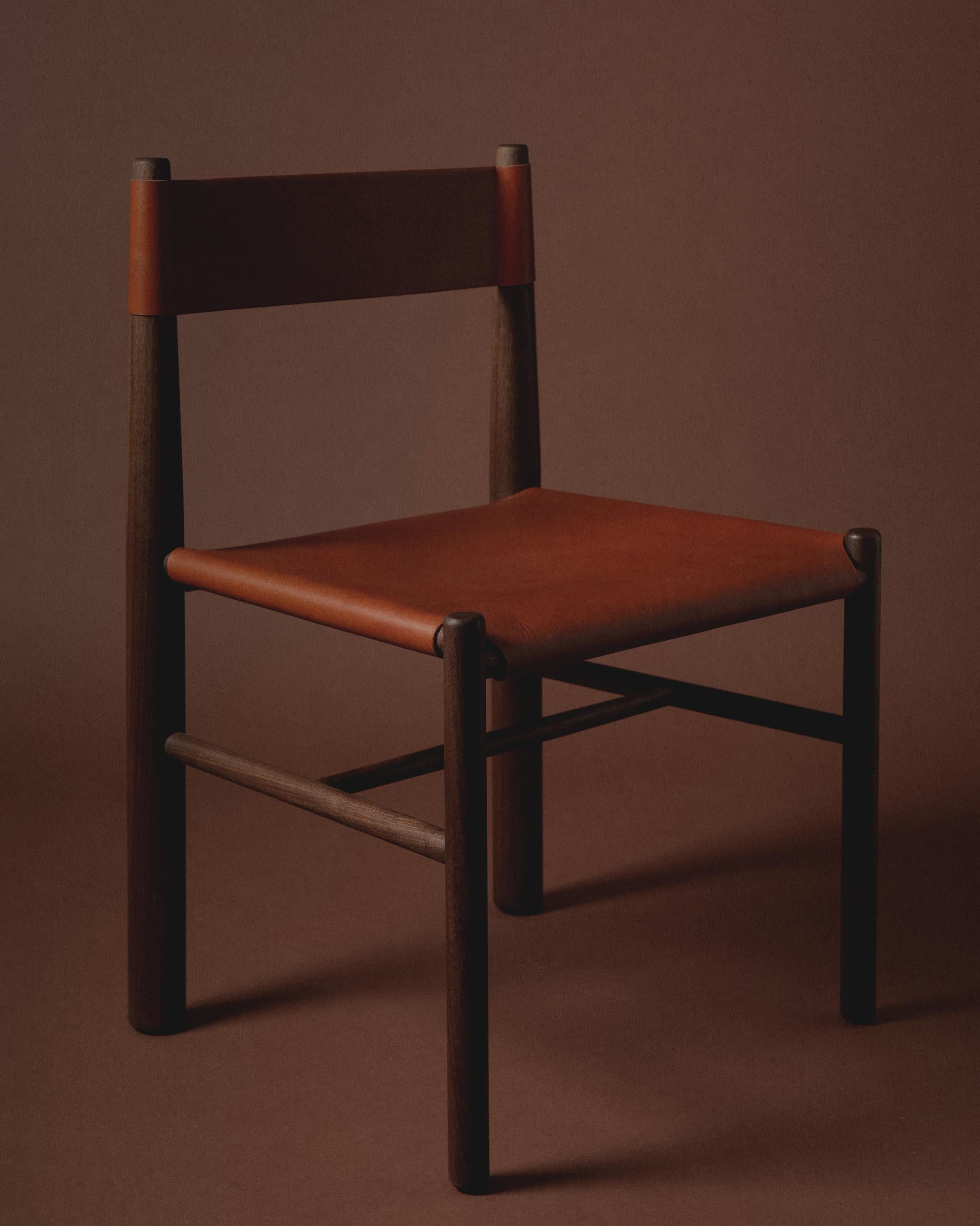 Inspired by utilitarian furniture, the Gradual Chair plays with the proportions of different size turned wood parts. The front and back legs are different diameters, and the back tapers, declining gradually to allow for a slung leather back. Leather