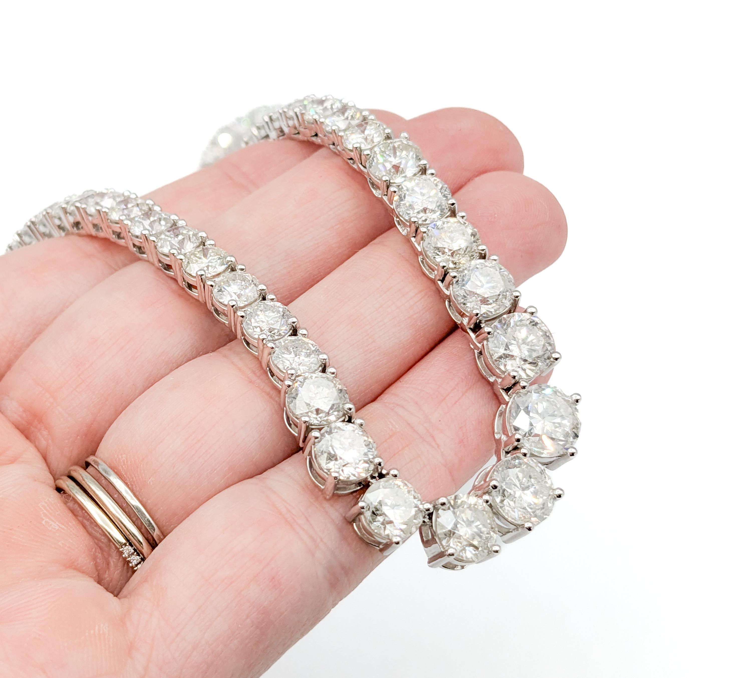Graduated 42.60ctw Diamond Riviera Tennis Necklace in Platinum

Introducing this exquisite contemporary diamond tennis necklace, crafted in luxurious platinum with a safety clasp. This stunning Diamond Fashion Necklace Riviera features an impressive