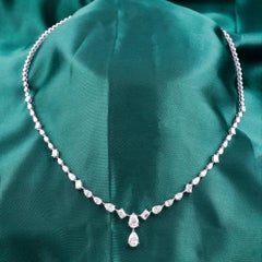 5,69 carati certificati. Collana con diamanti a forma di pera e maglie con taglio smeraldo, in oro bianco 18 carati