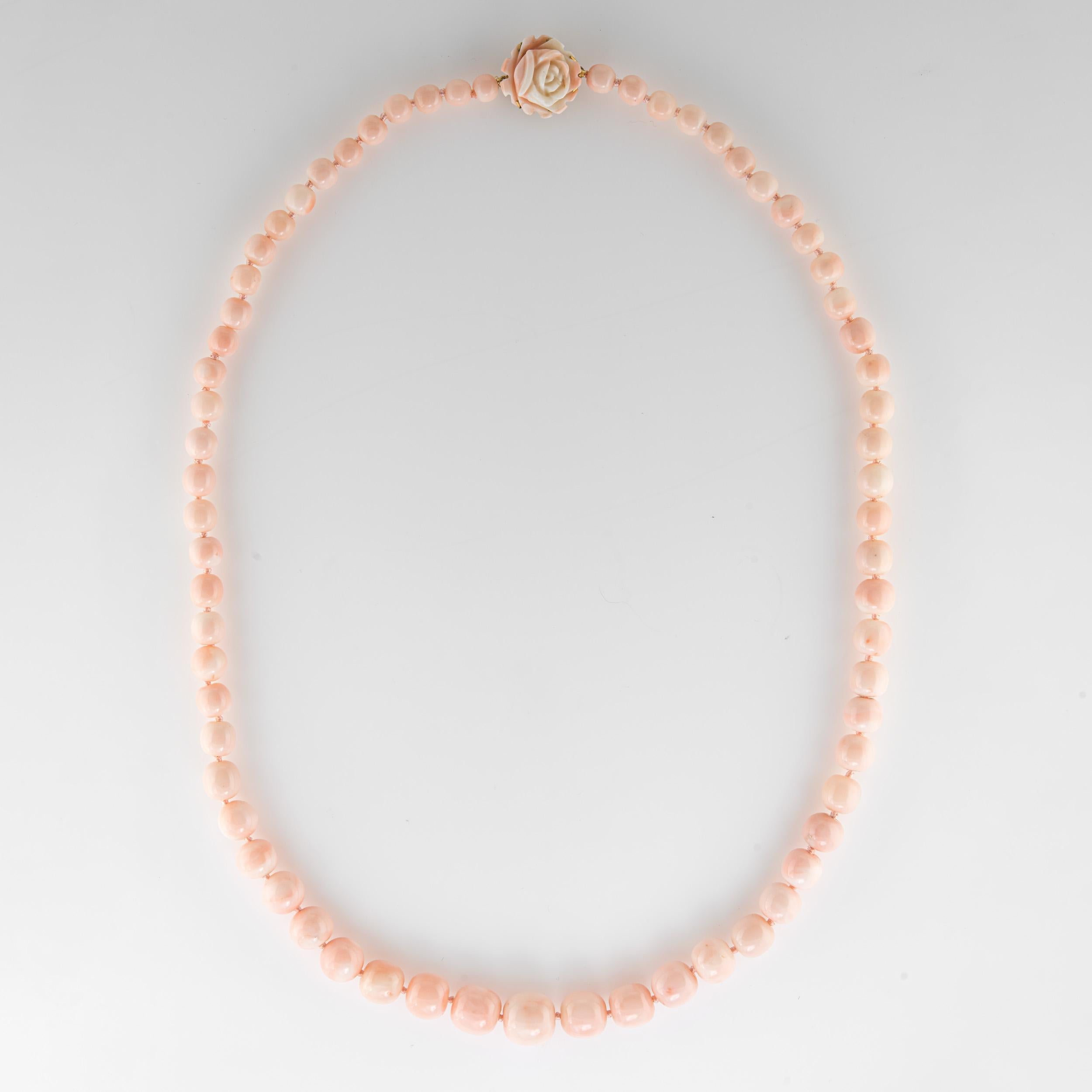 Finely detailed vintage angel skin coral necklace finished with a yellow gold plated floral clasp (circa 1950s to 1960s). 

The coral beads graduate in size from 6.5mm to 12.5mm. The beads are in excellent condition and free of cracks or chips. The