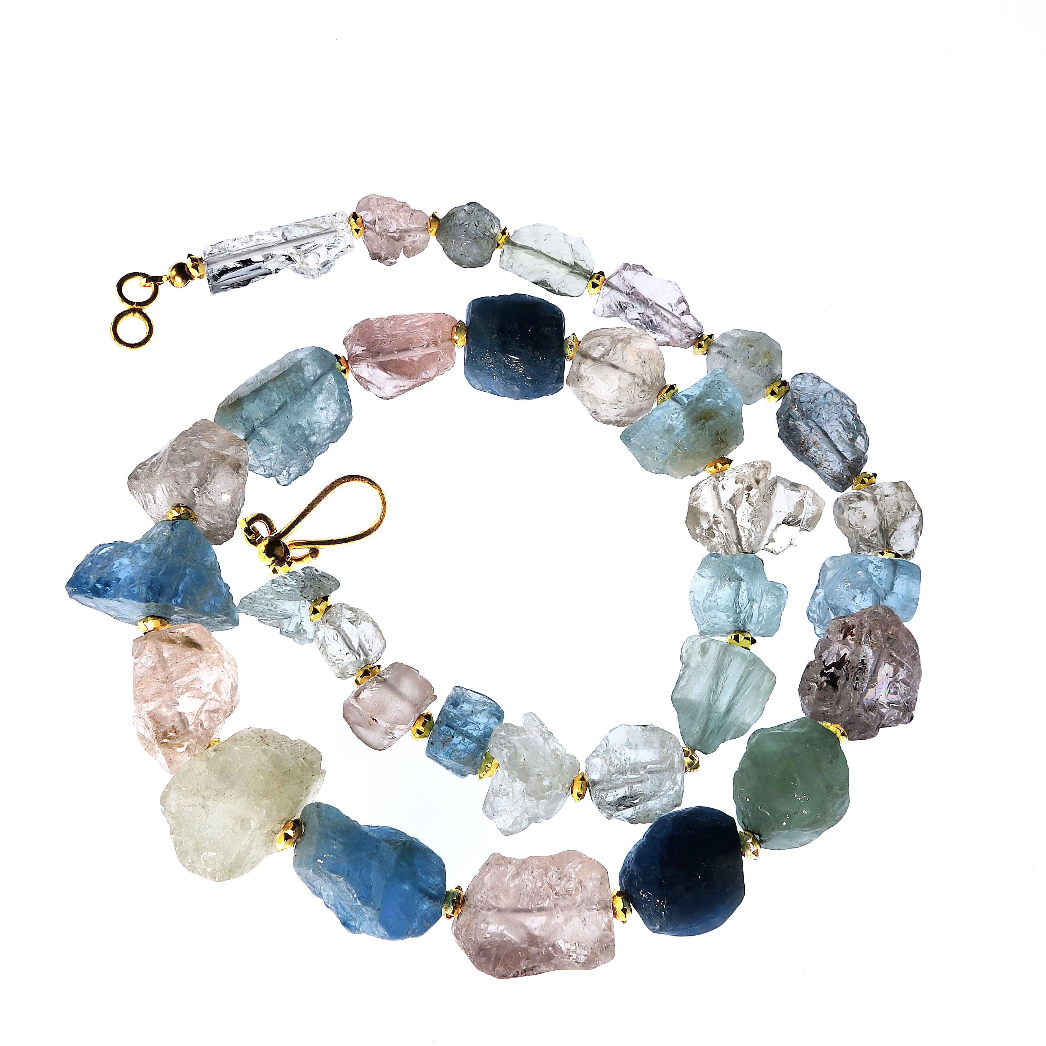Unique necklace of unfaceted Beryls: Blue Aquamarine, Pink Morganite, Green Beryl, and Clear Goshenite. This material is a beautiful display of beryl colors. The 20.5 inch necklace is graduated from approximately 8x8mm to 23x14mm. The gemstones are