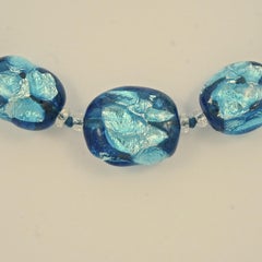 Graduated Blue Foil Glass Bead Necklace with a Silver Clasp