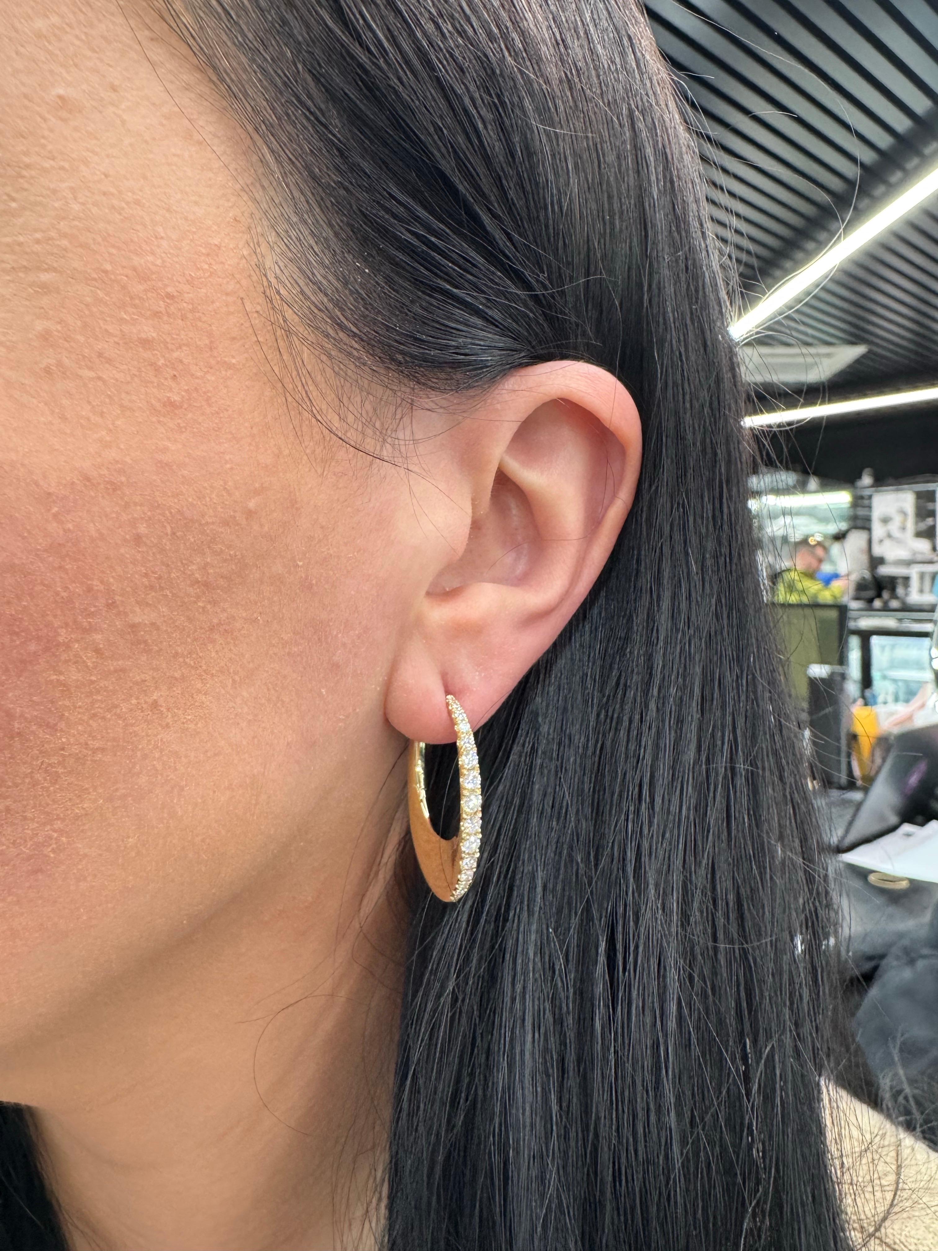 14 Karat yellow gold hoop earrings featuring 30 graduated round brilliants weighing 1.08 Carats. Great looking!!

Available in white and rose gold. 
More diamond hoops in stock
Message for more pictures and details. 