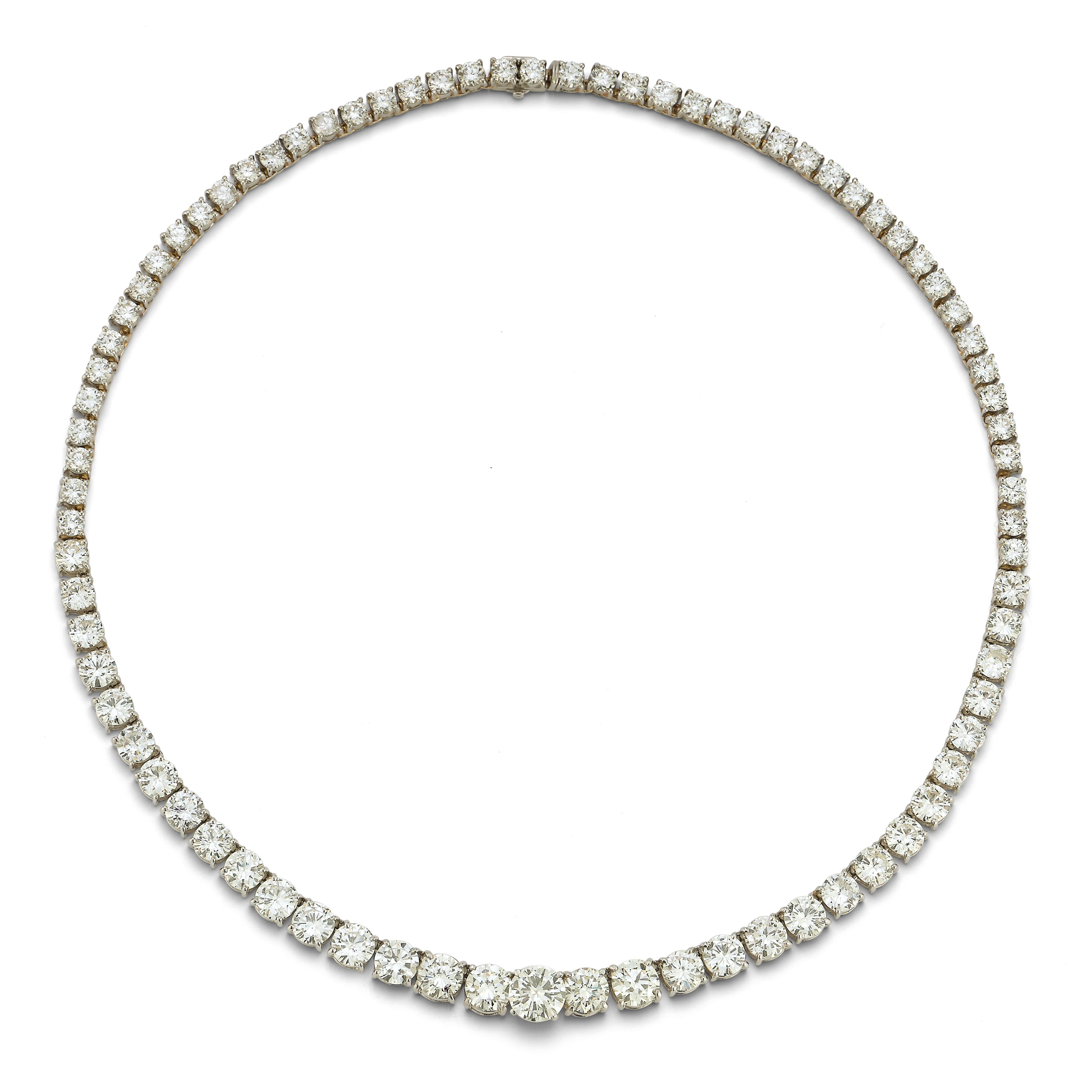 Graduated Diamond Rivière Necklace, an array of 81 graduated round cut diamonds totaling approximately 26.00 carats, including a center diamond weight of approximately 2.00 carats set in platinum. Quality of all stones range around J/K/L color &