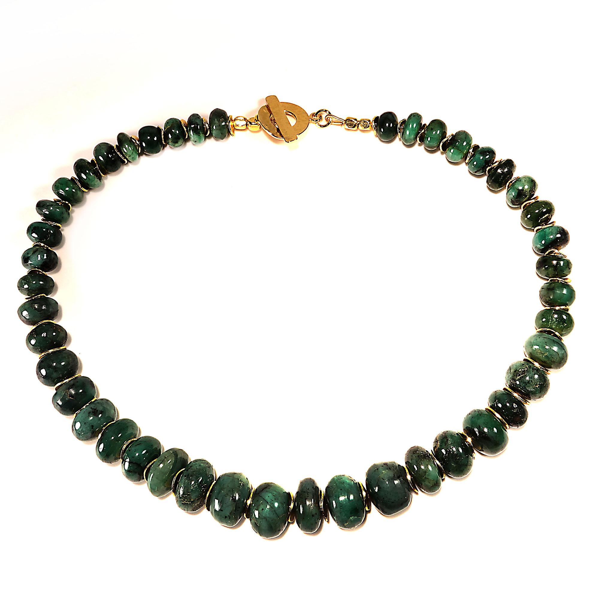 16.5 Inch choker necklace of emerald rondels accented with gold tone flutters.  This handmade emerald in matrix choker is a pleasure to wear and green such a great color to wear.  The highly polished rondels of opaque emerald are unique in size and