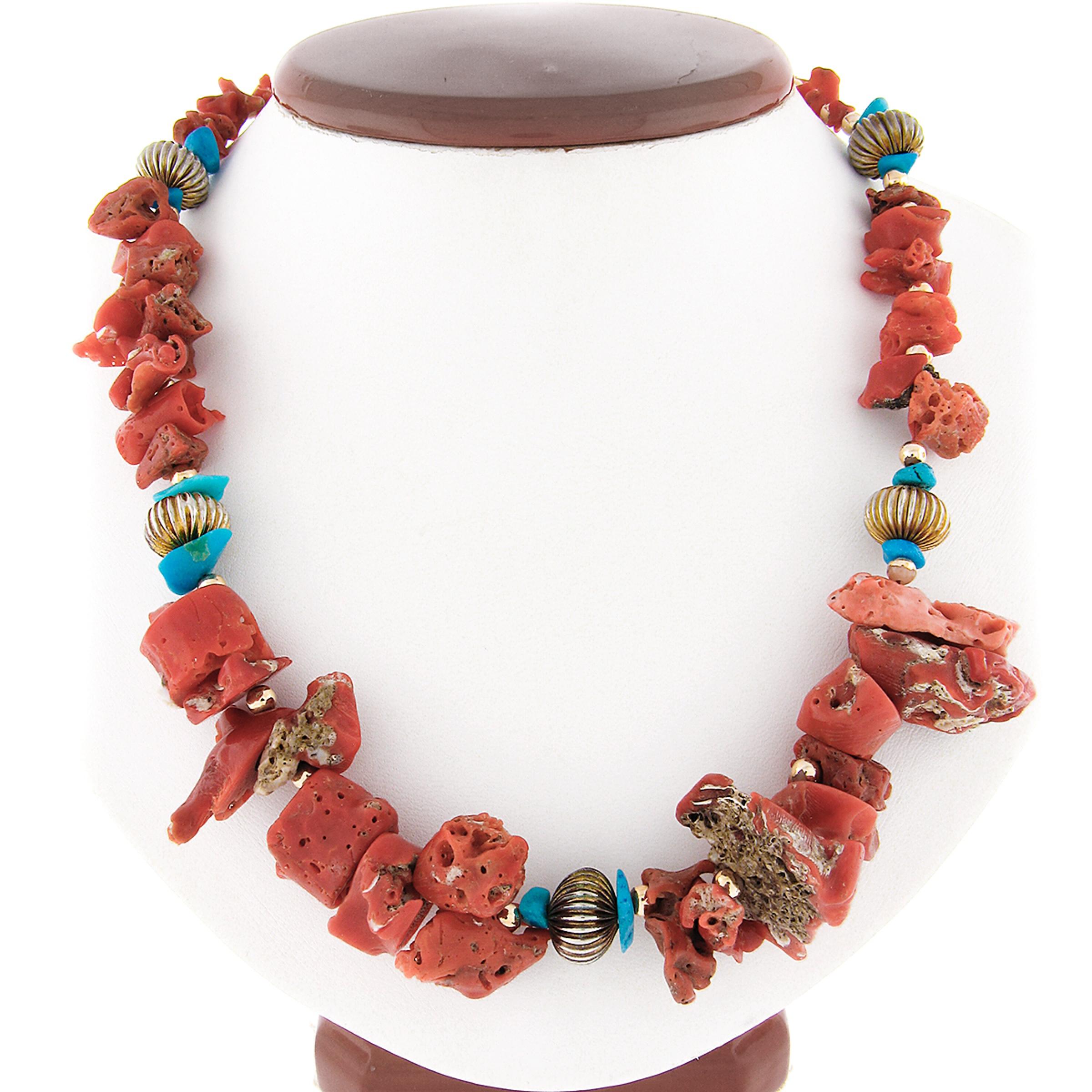 This magnificent strand necklace features natural freeform coral and turquoise beads neatly strung with metal bead spacers throughout. The gorgeous coral are GIA certified (2 beads were chosen at random for testing) as being 100% natural with a