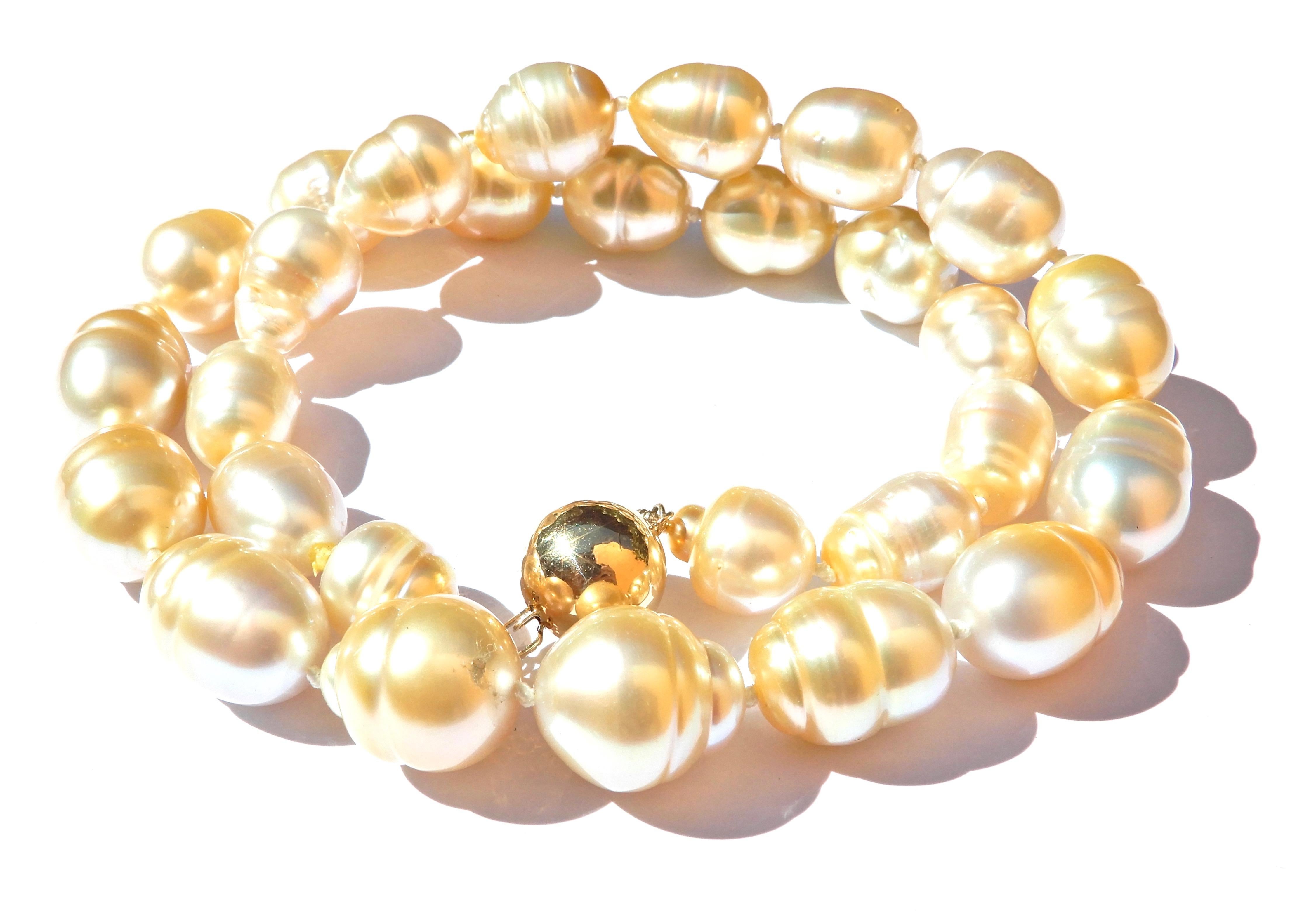 Golden and beautiful, this Graduated Golden South Sea Pearl and 9 Carat Yellow Gold Necklace is a show stopper. 

Gorgeous from every angle, this strand of 28 individually knotted, graduated golden south sea pearls measures 45cm in length. 

Fall in