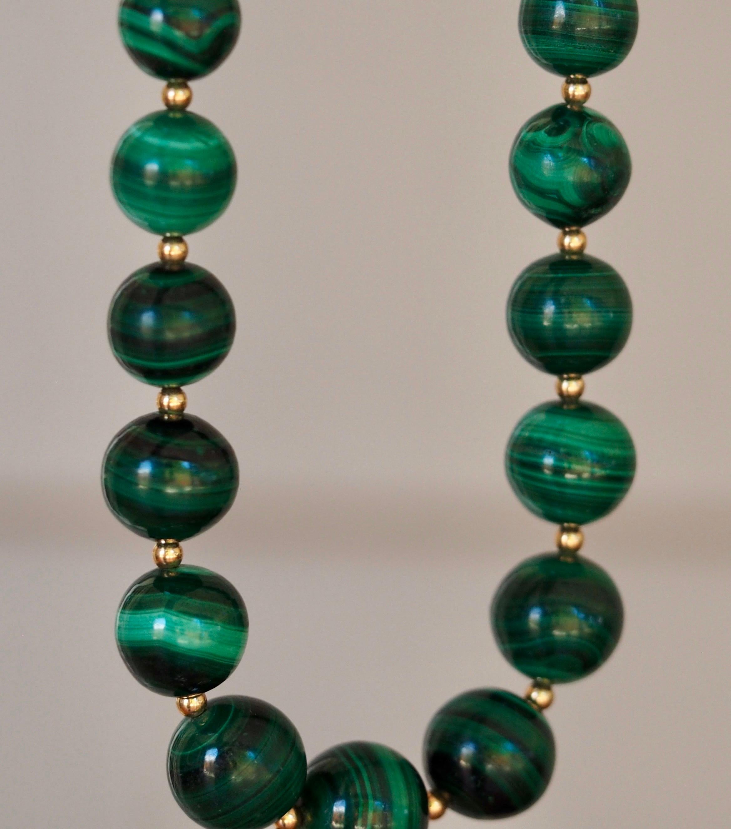 Graduated Malachite Bead Necklace is absolutely mesmerizing.  This necklace is made of 49 beads graduating from 6.41 mm - 14.42 mm alternating with gold filled beads for a perfect accent and is finished with a spring ring clasp.  The strand is 25
