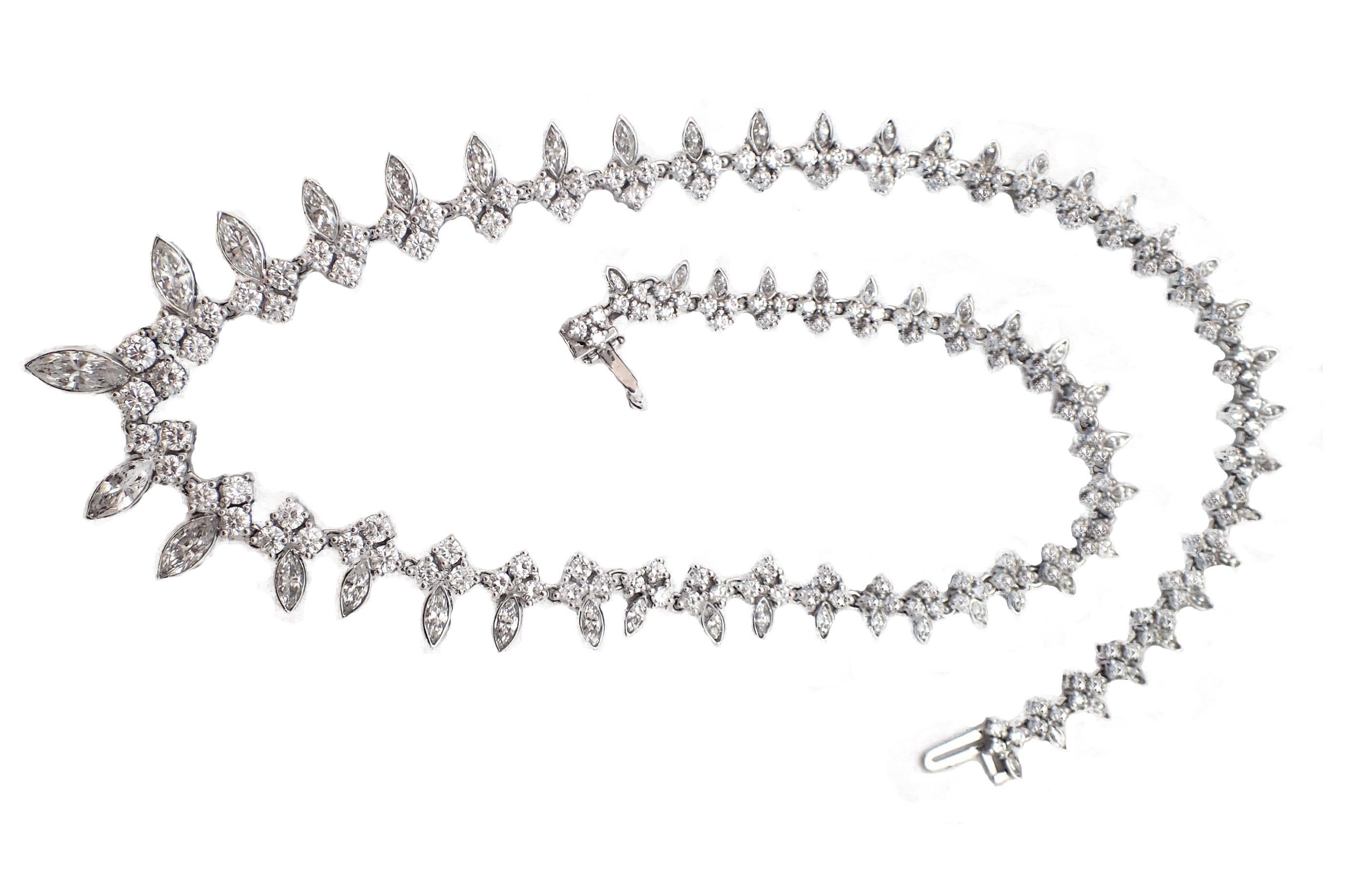 This creative use of graduated marquise and round diamonds make this necklace a unique addition to your jewelry collection! This stunning piece features a total diamond weight of approximately 14ct and is set in 18kt white gold.  H color, VS clarity