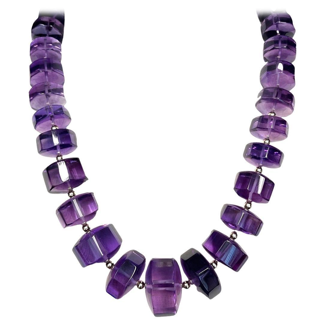 Collana con perline ottagonali graduate di ametista con oro giallo 14 e 18 ct.