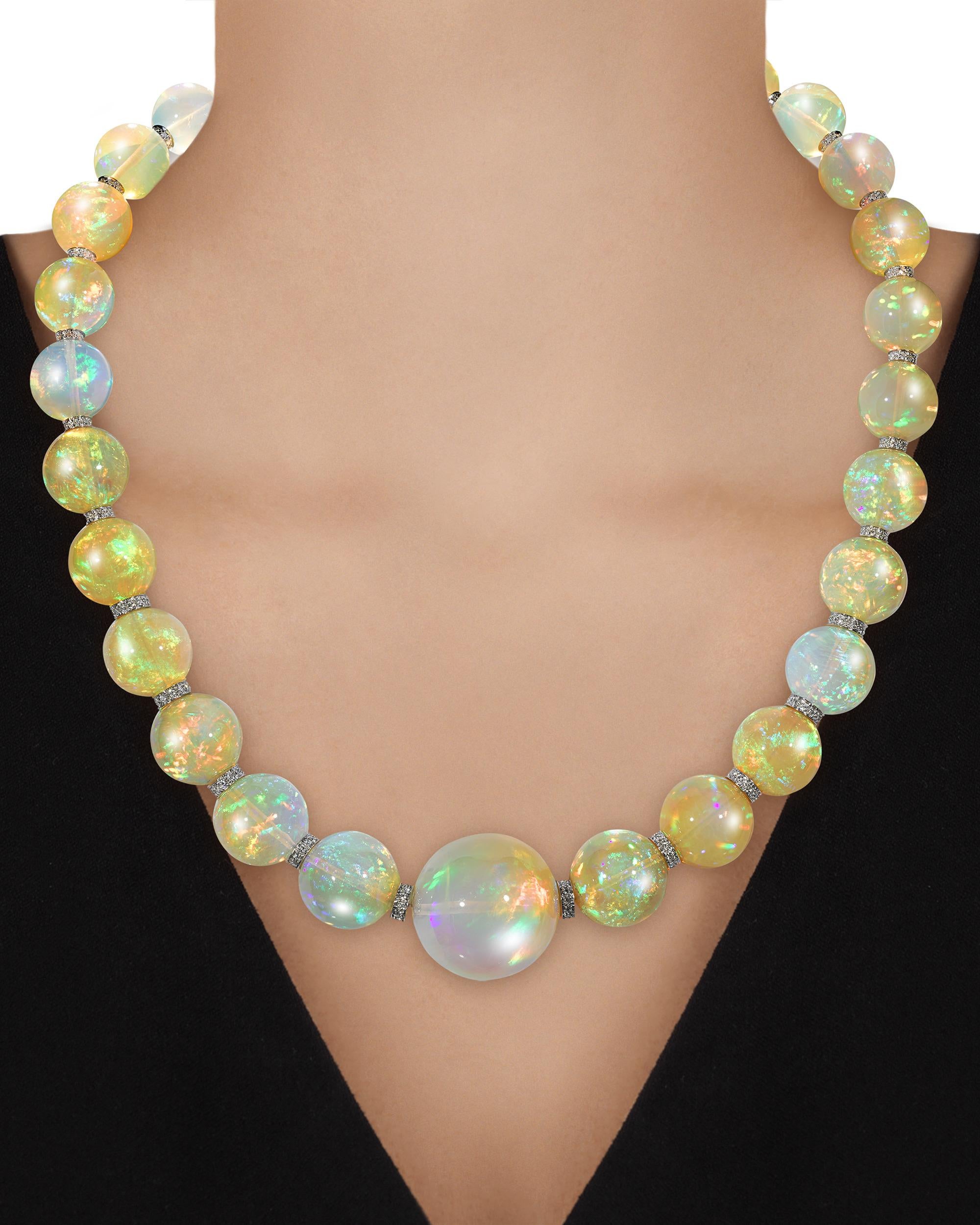 Twenty-nine solid opal beads totaling an extraordinary 554.00 carats comprise this mesmerizing necklace. The graduated gems are an impressive size, measuring from 23.8mm to 13mm, with each exhibiting a high level of translucence and a rainbow of