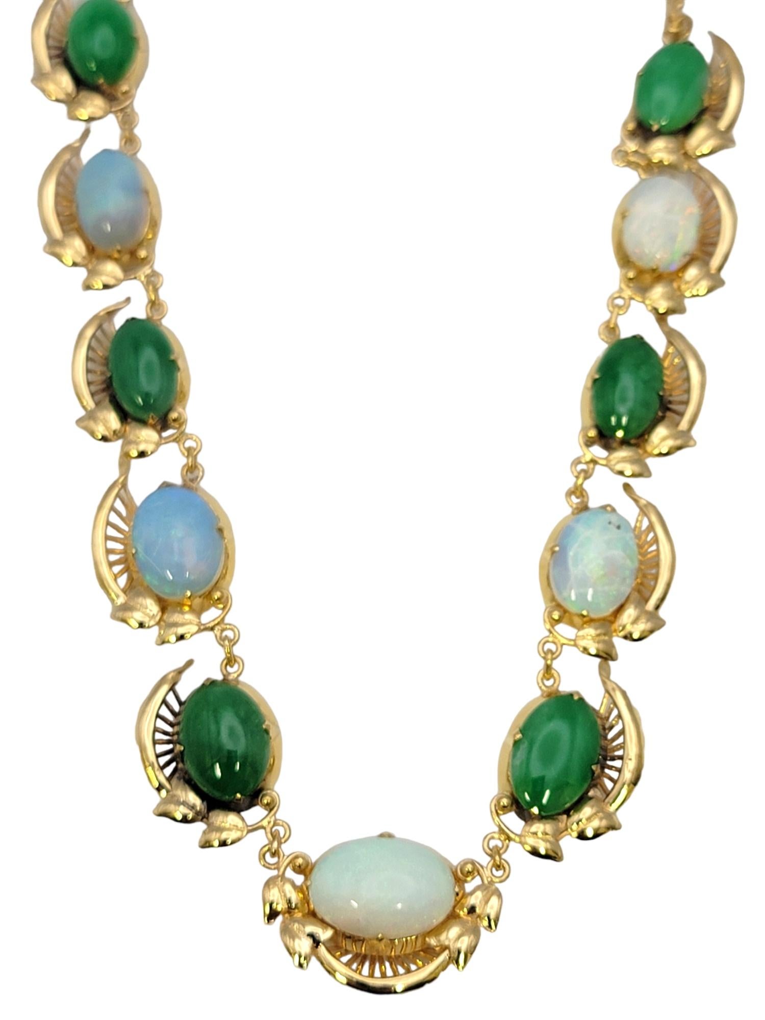 Colorful and elegant necklace featuring stunning opal and jadeite gemstones. Each beautifully striated natural stone has its own unique color and design, creating a truly one of a kind piece.  
 
This beautiful piece of fine jewelry features a