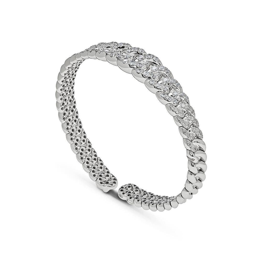Introducing our exquisite White Gold Graduated Pave Chain Link Cuff Bracelet, a stunning piece that exudes elegance and sophistication. Crafted from luxurious 18-karat white gold, this cuff bracelet features a unique graduated pave chain link design