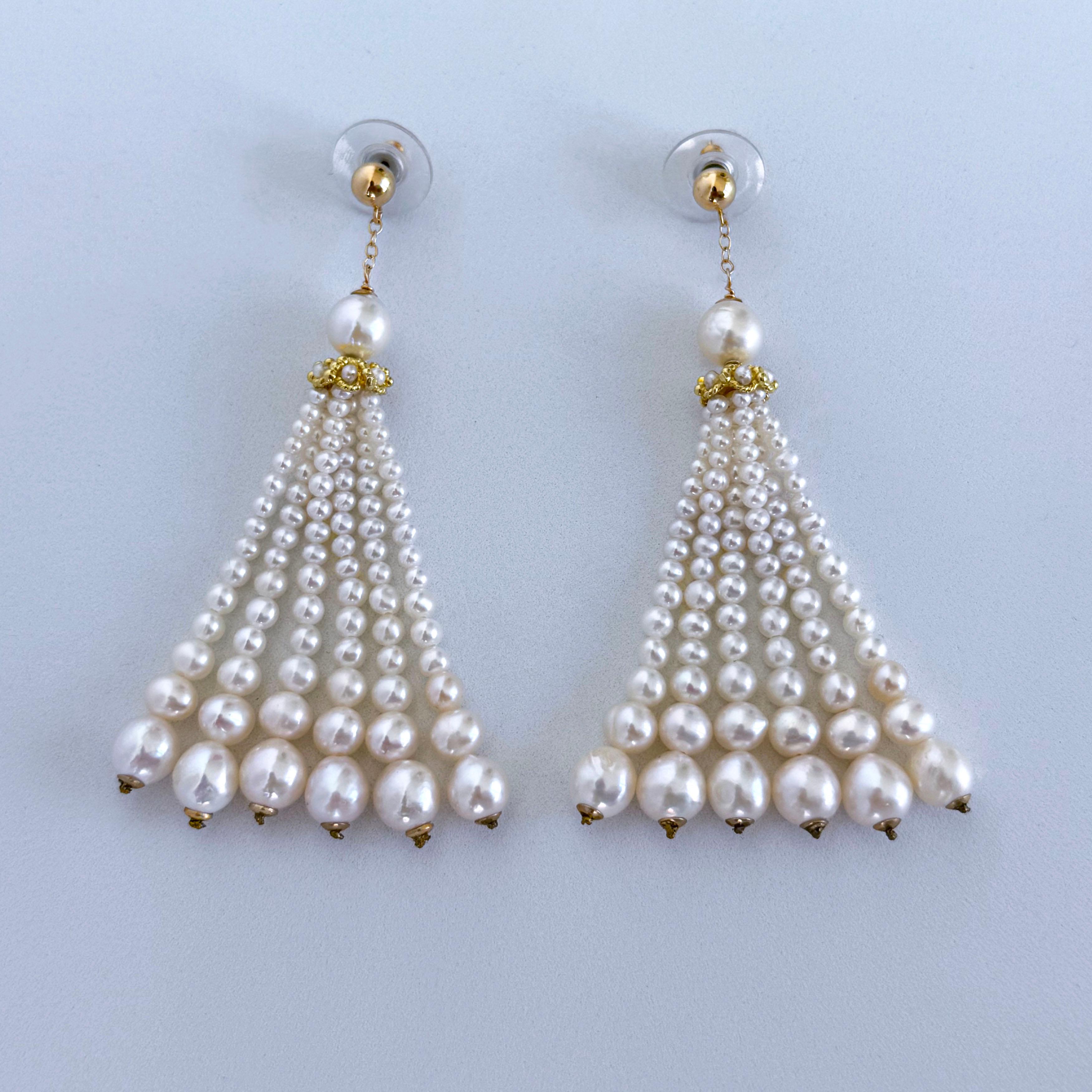Dangle and Tassel Pearl Studded Earrings by Marina J.
This pair is made with all Solid 14k Yellow Gold and Pearls. Two Solid 14k Yellow Gold Beads sit at the Studded top of this pair from which Solid 14k Yellow Gold chain hangs.
Round Pearls sit