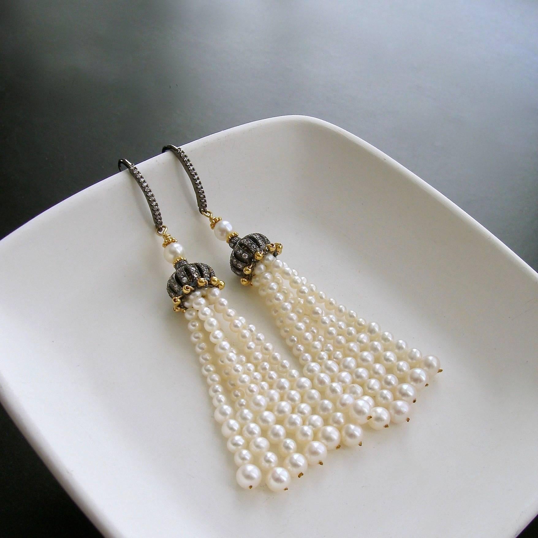 Anais Earrings.

Graduated candlelight pearls create a mesmerizing tassel that is much more than just a little flattering.  This is Boho Chic at its finest - elegant and intriguing as the pearl strands sway with your every movement.  A clever little