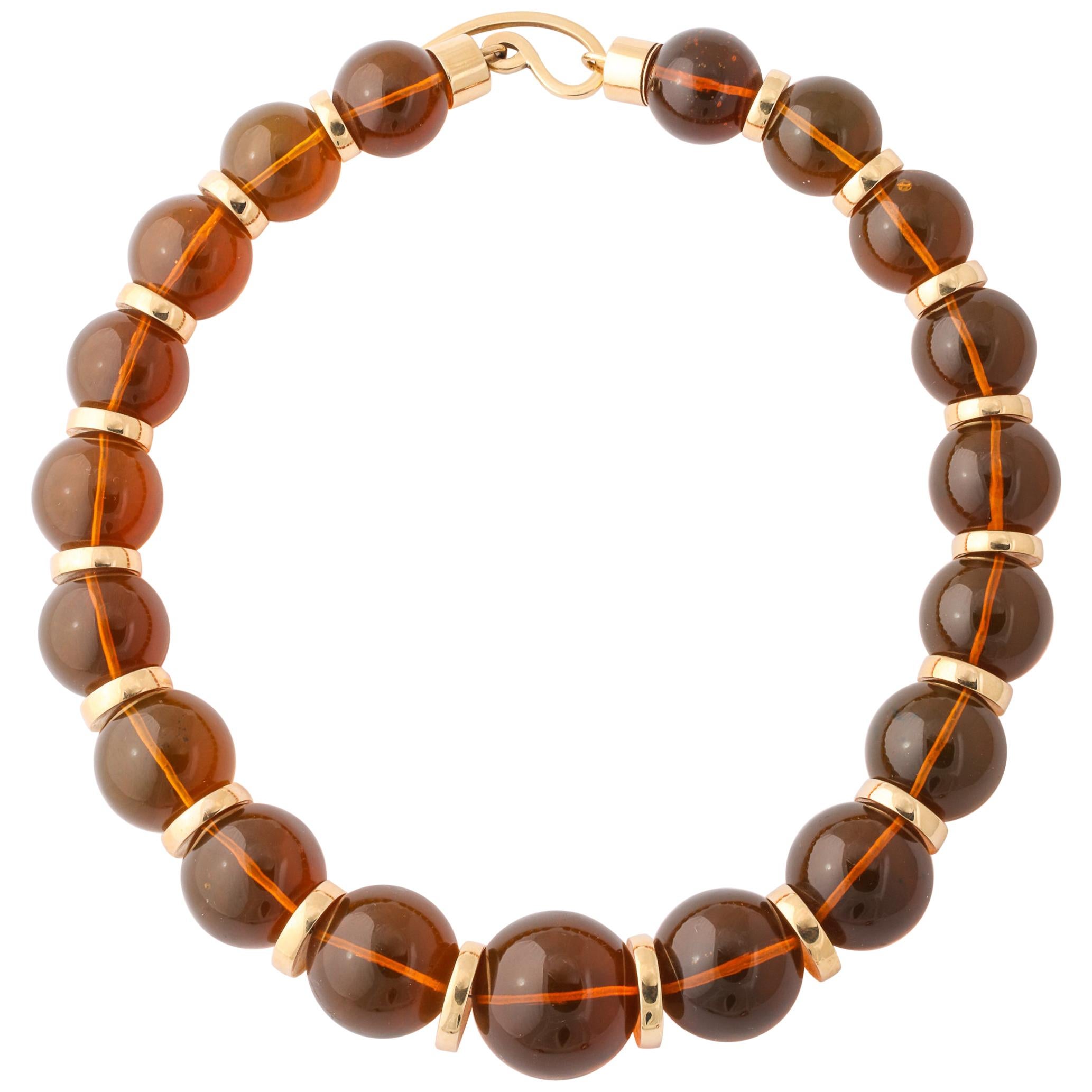 Graduated Reconstituted Amber and 18 Karat Yellow Gold Rondel Necklace For Sale