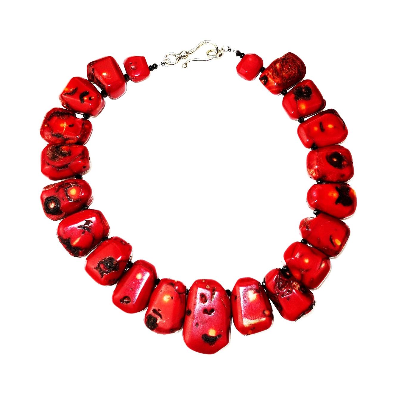 Gorgeous, handmade Deep Red Coral with distinctive black markings necklace. The bamboo coral ranges in length from 27mm to 43mm. The individual bamboo corals are accented with faceted black Spinel. This unique necklace is secured with a Sterling