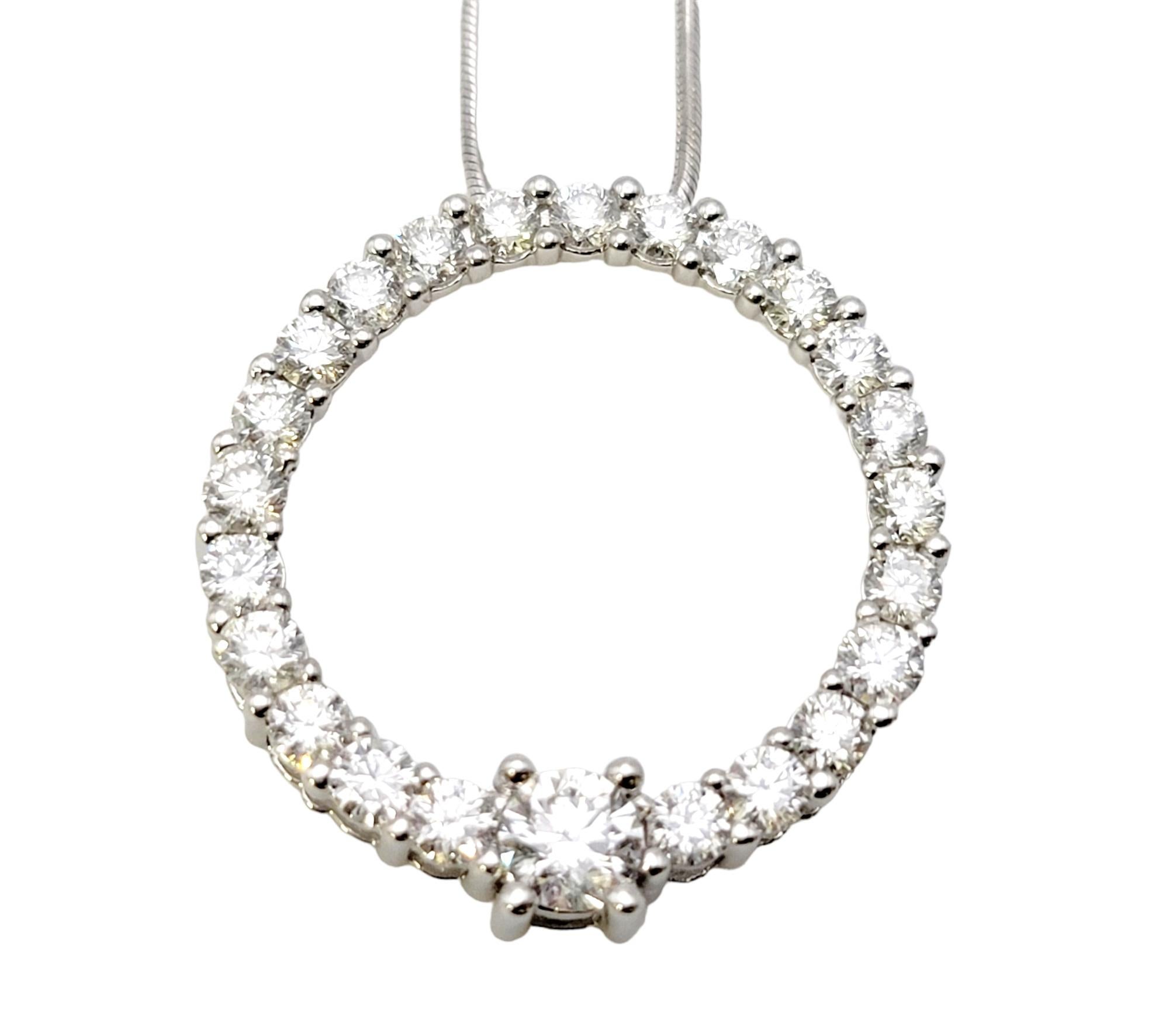 Indulge in the timeless elegance of this stunning diamond circle pendant necklace, meticulously crafted in radiant white gold. With its delicate design and brilliant diamond accents, this necklace effortlessly combines sophistication and modernity,
