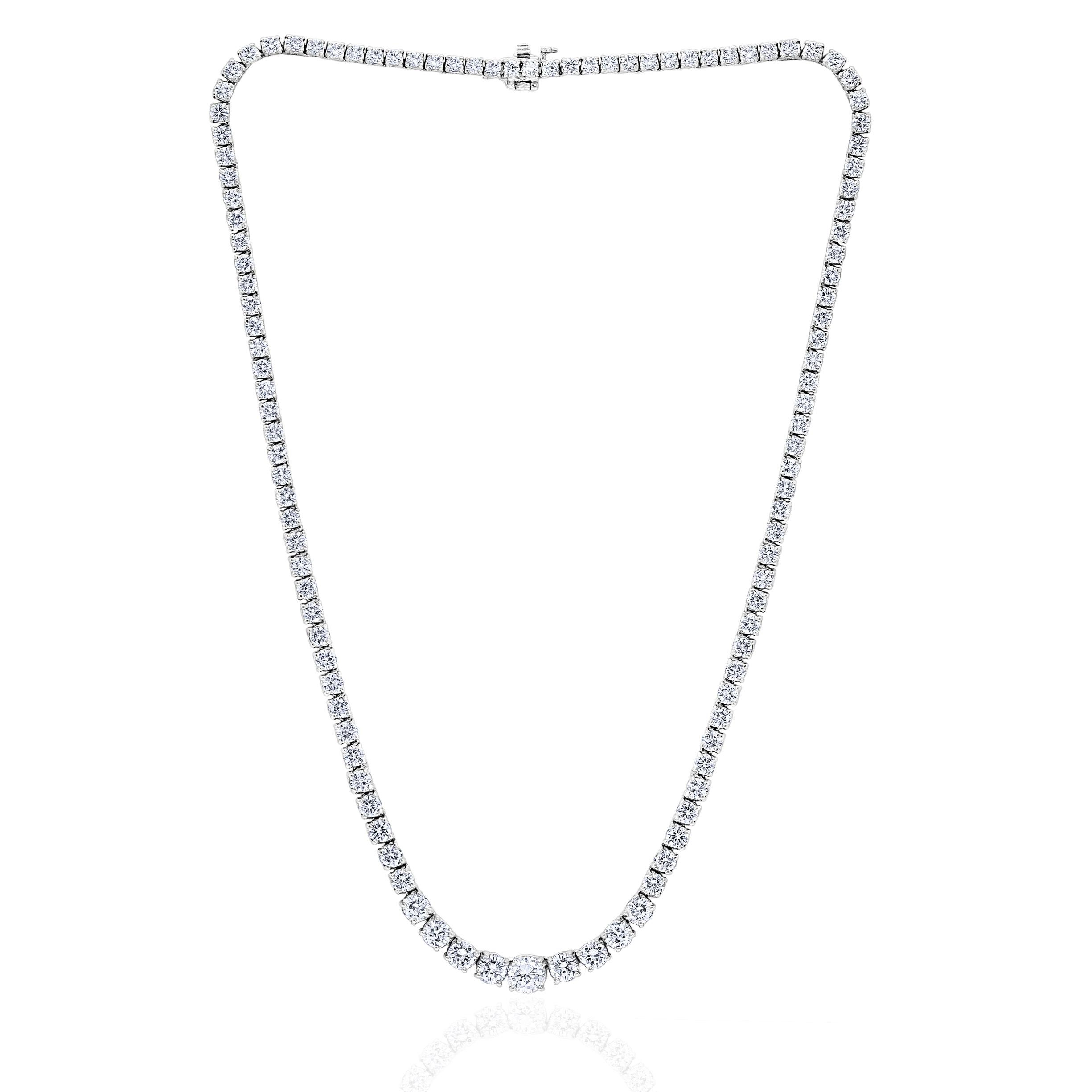 A series of graduated Round Diamonds in a Tennis Necklace setting.

Diamonds are of H-I color and SI clarity.
Set in White Gold.
13.20 Carat Total Weight

Measures 17 inches