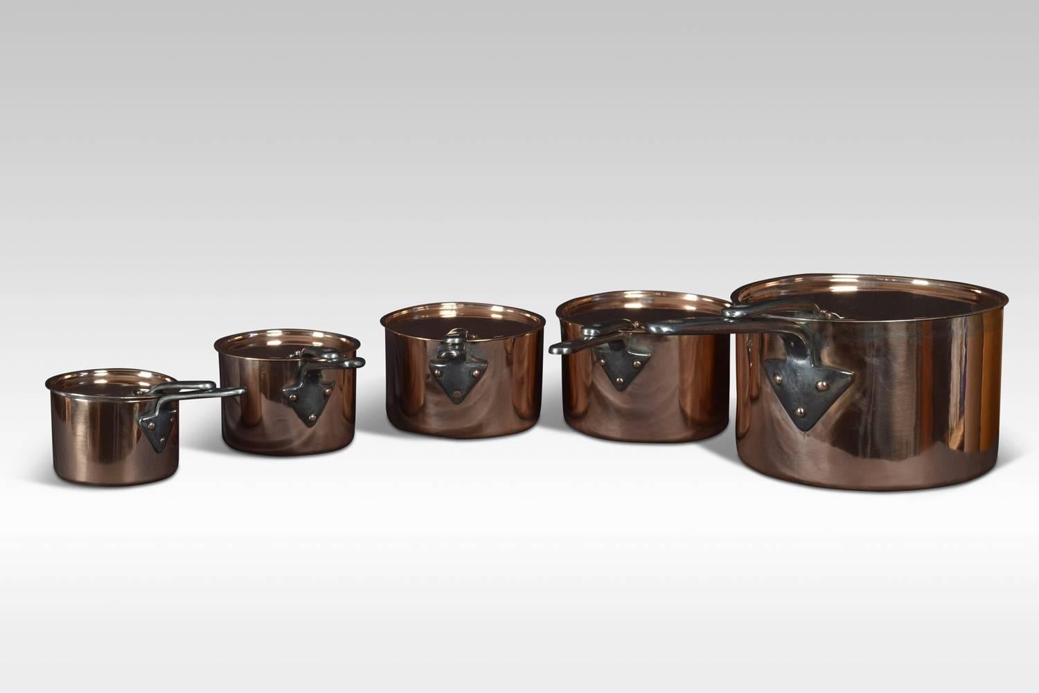 Late 19th century graduated set of five Victorian copper pans and lids with conforming iron handles. On an associated black-painted iron stand.
Dimensions:
Height 40.5 inches
Width 14 inches
Depth 14 inches.