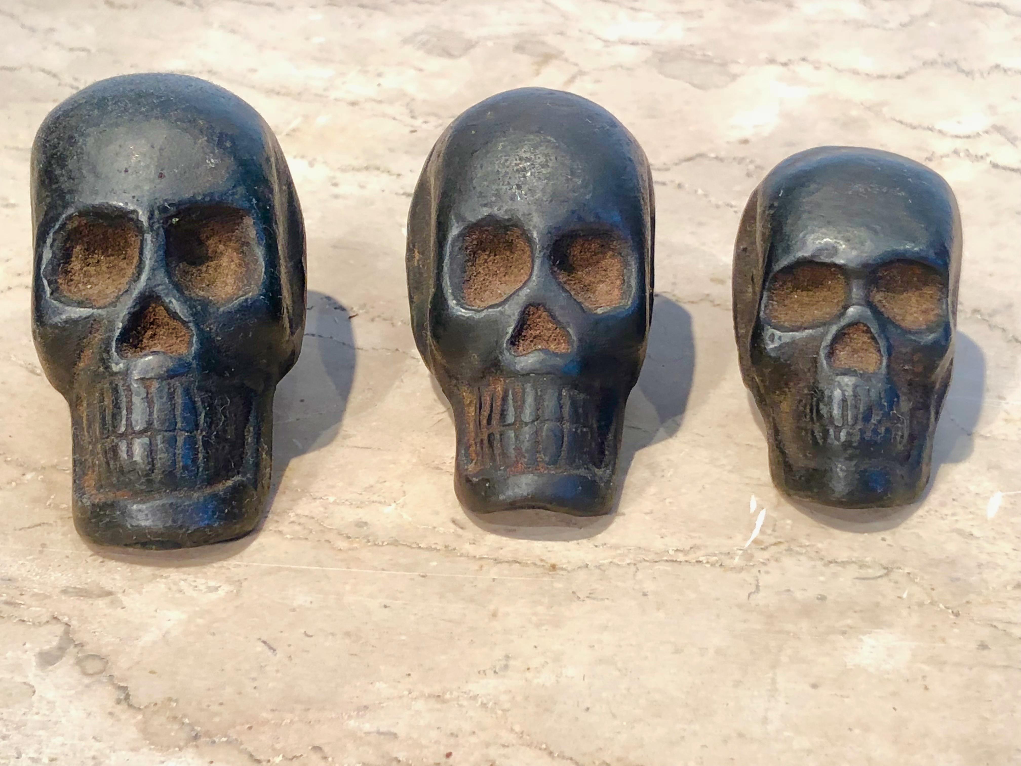 We bought these cast iron skulls because they are so very cool, although probably not very old. Presumably opium weights, they have little wells on the underside of the skulls for weighing out opium, but since we're not in the opium business, we