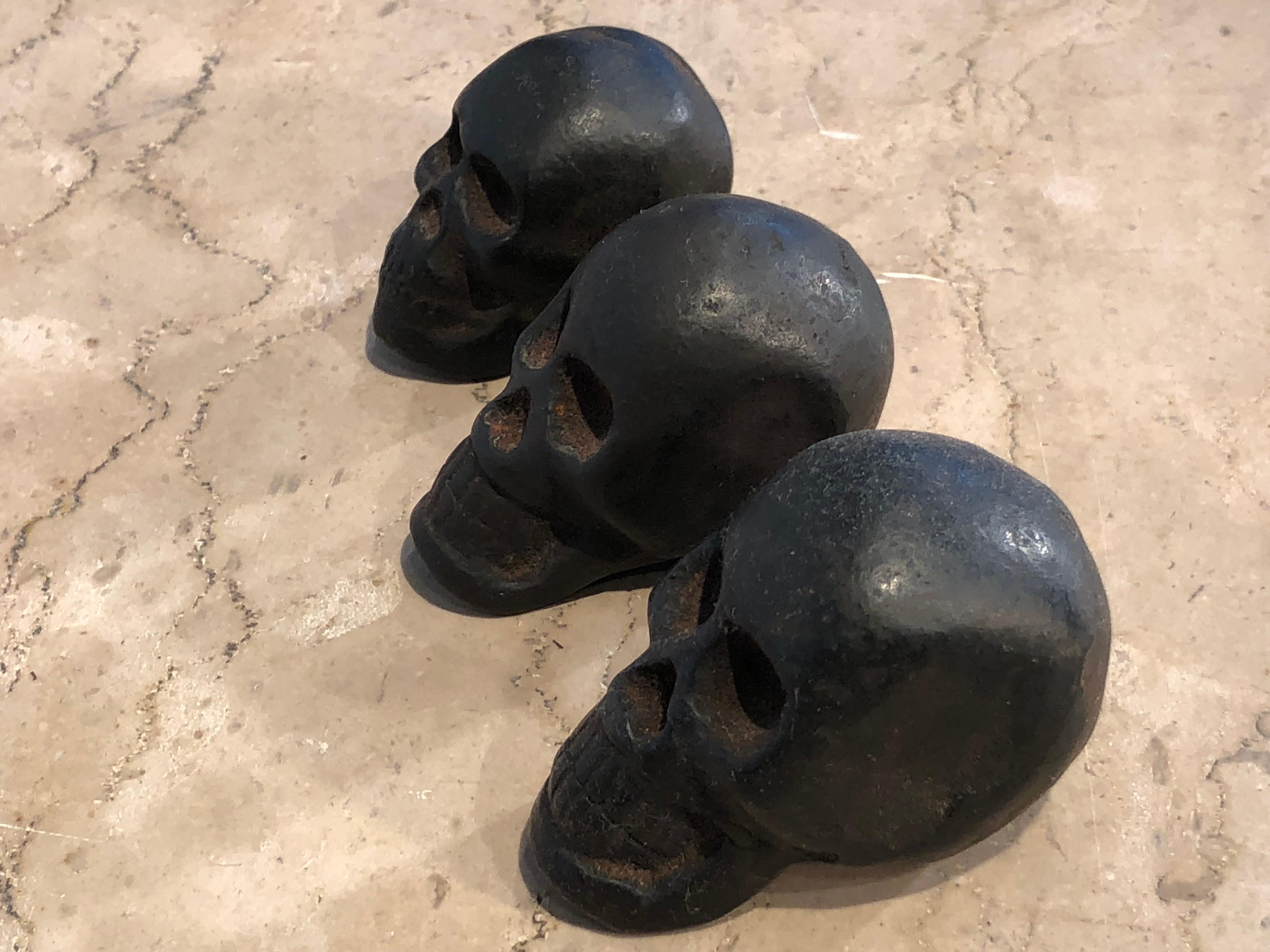 English Graduated Set of Three Cast Iron Skull Opium Weights