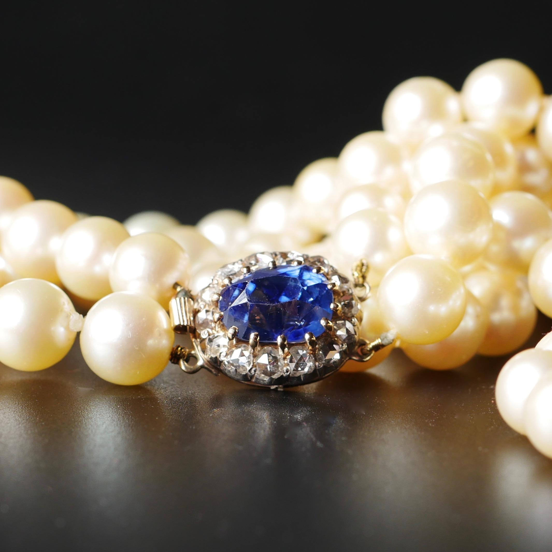 A two-row cultured pearl necklace 41 cms in length

Complete with a Diamond and Sapphire clasp

The diamonds are old rose cut diamonds and an estimated 1.70cts 
The mid deep blue Ceylon sapphire is 4.20cts and certificated with no indication of any