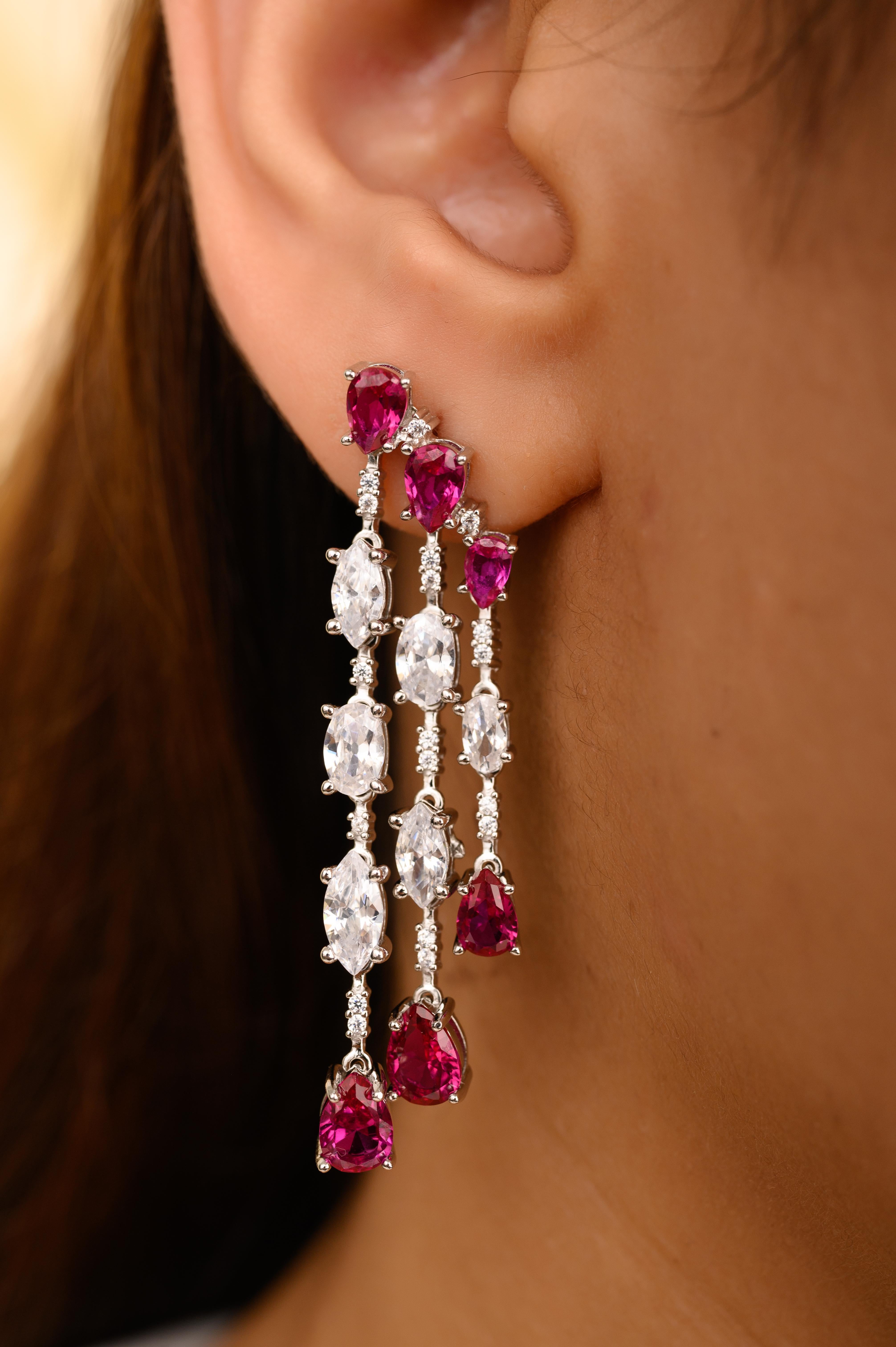 Graduation Pink Zircon Partywear Fashion Dangle Earrings in sterling silver. You shall need these dangle earrings to make a statement with your look. Each piece features dazzling cubic zirconia stones, renowned for their brilliance and clarity, set