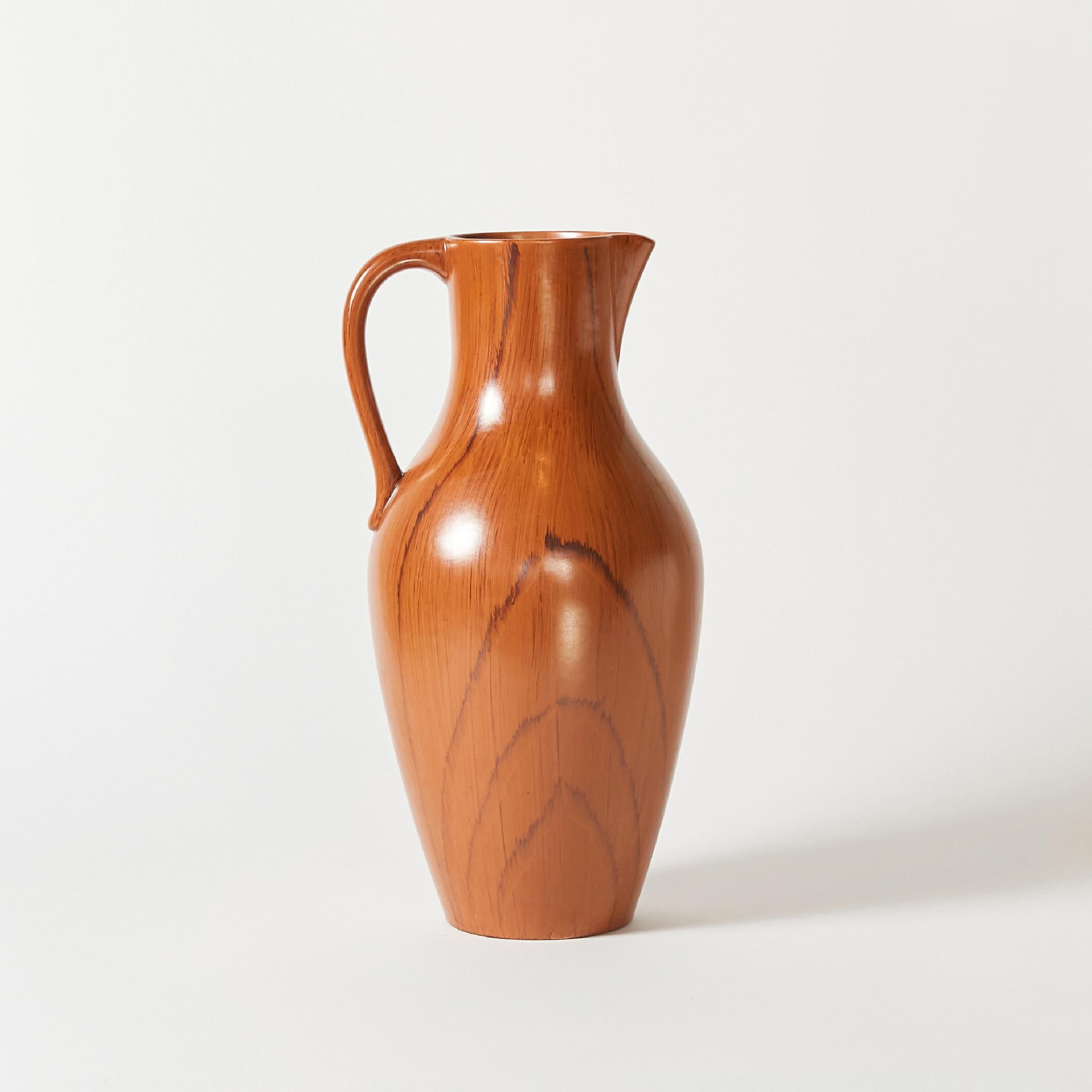 A Gräfenroda Keramik extra large ceramic pitcher. Originally hand finished in faux wood pattern with satin glaze.
Made in Germany in 1950s.
Labeled.