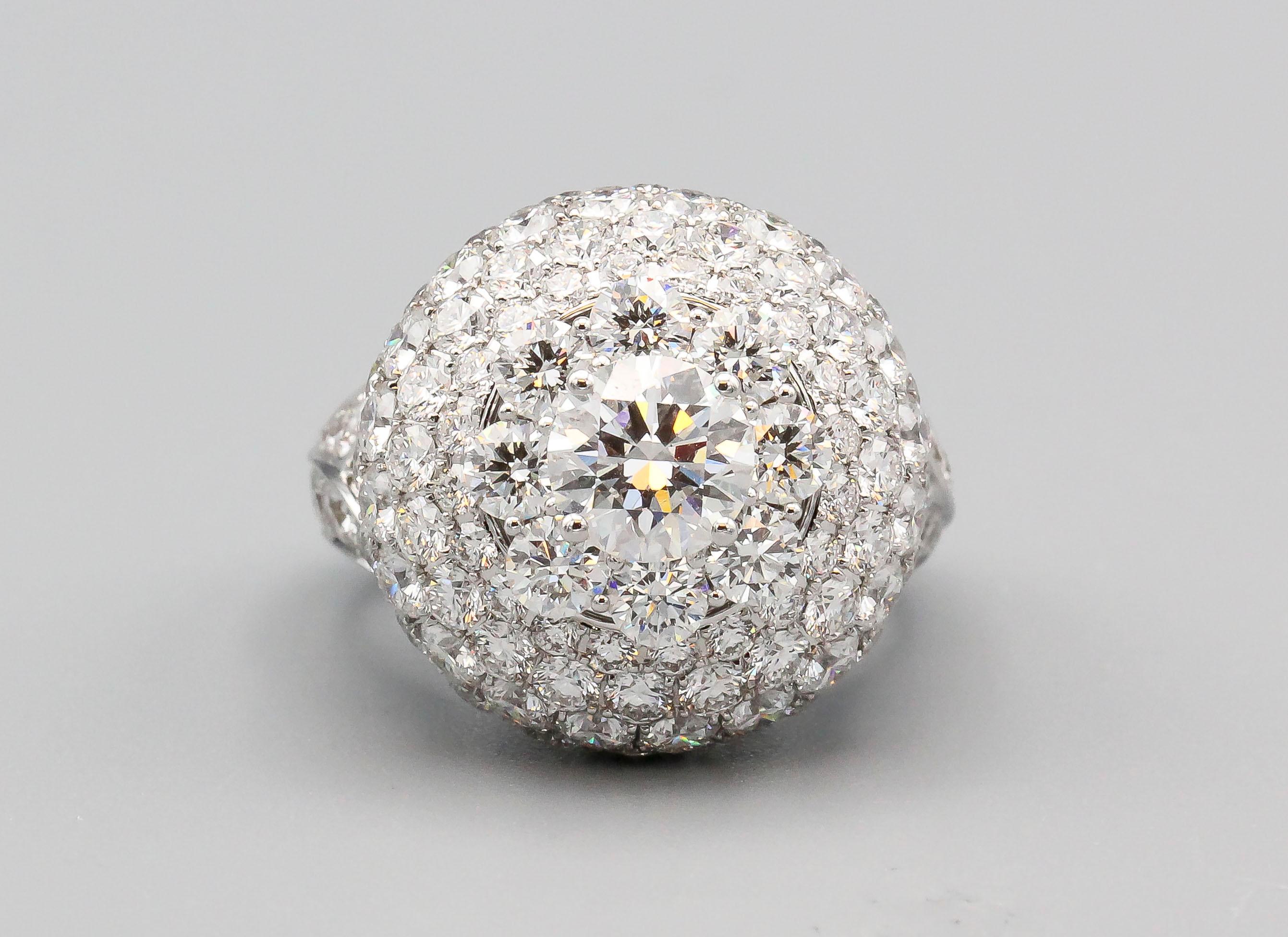 Very fine diamond and 18K white gold dome ring by Graff. It features a 1.22 carat F color VS2 round brilliant cut diamond center stone; further complimented with various high grade round brilliant cut diamonds in a pave setting, approx. 9 carats in
