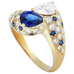 Bague en or jaune 18 carats avec diamant de 1::40 carat et saphir bleu de Graff