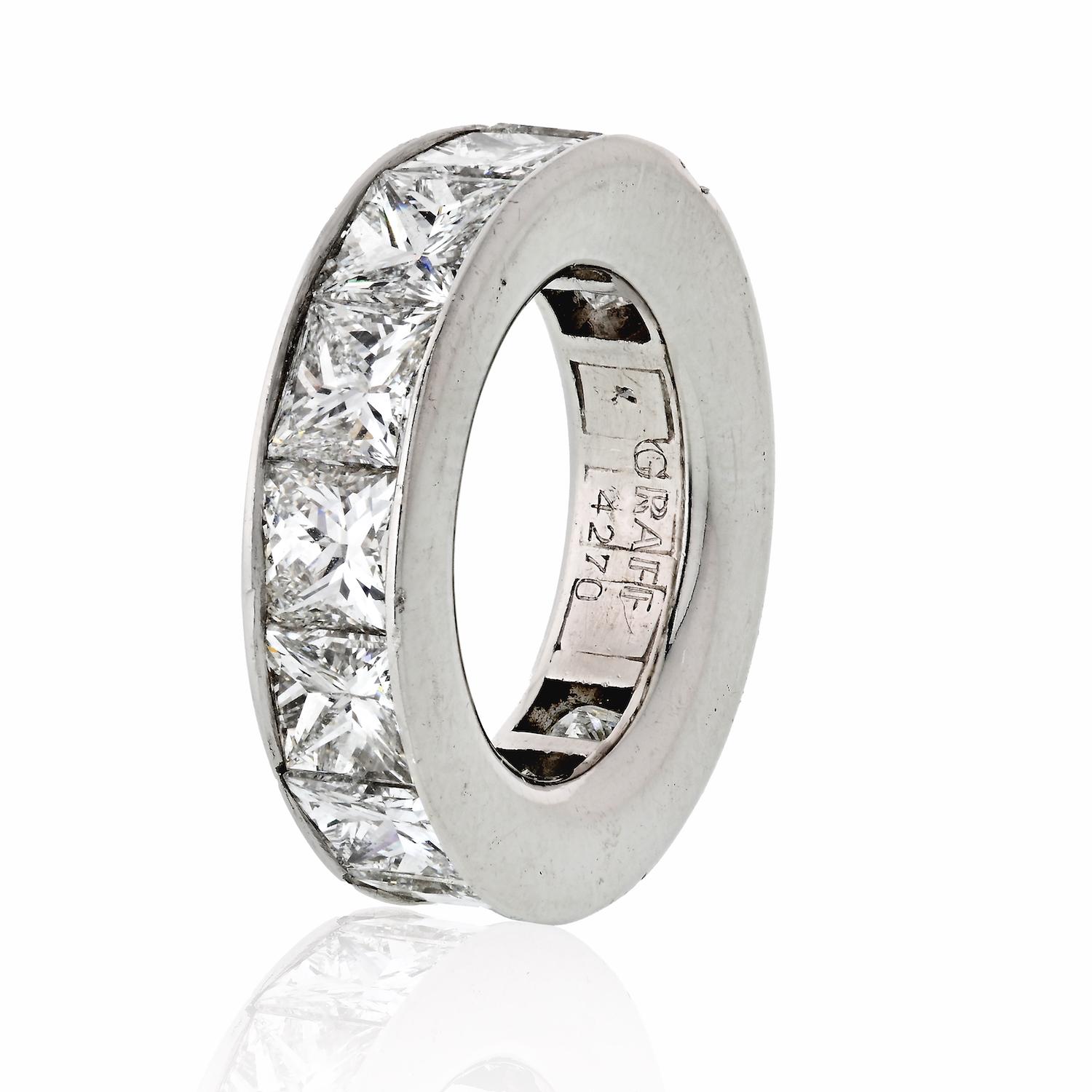 An important diamond eternity band by GRAFF is mounted with 14 princess-cut diamonds of D to F in color and VVS1-VVS2 clarity. The total carat weight of the ring is 14.30cts. 
Current finger size 6.5.
Original GRAFF box. 

Size 6.5 
Width: 6mm