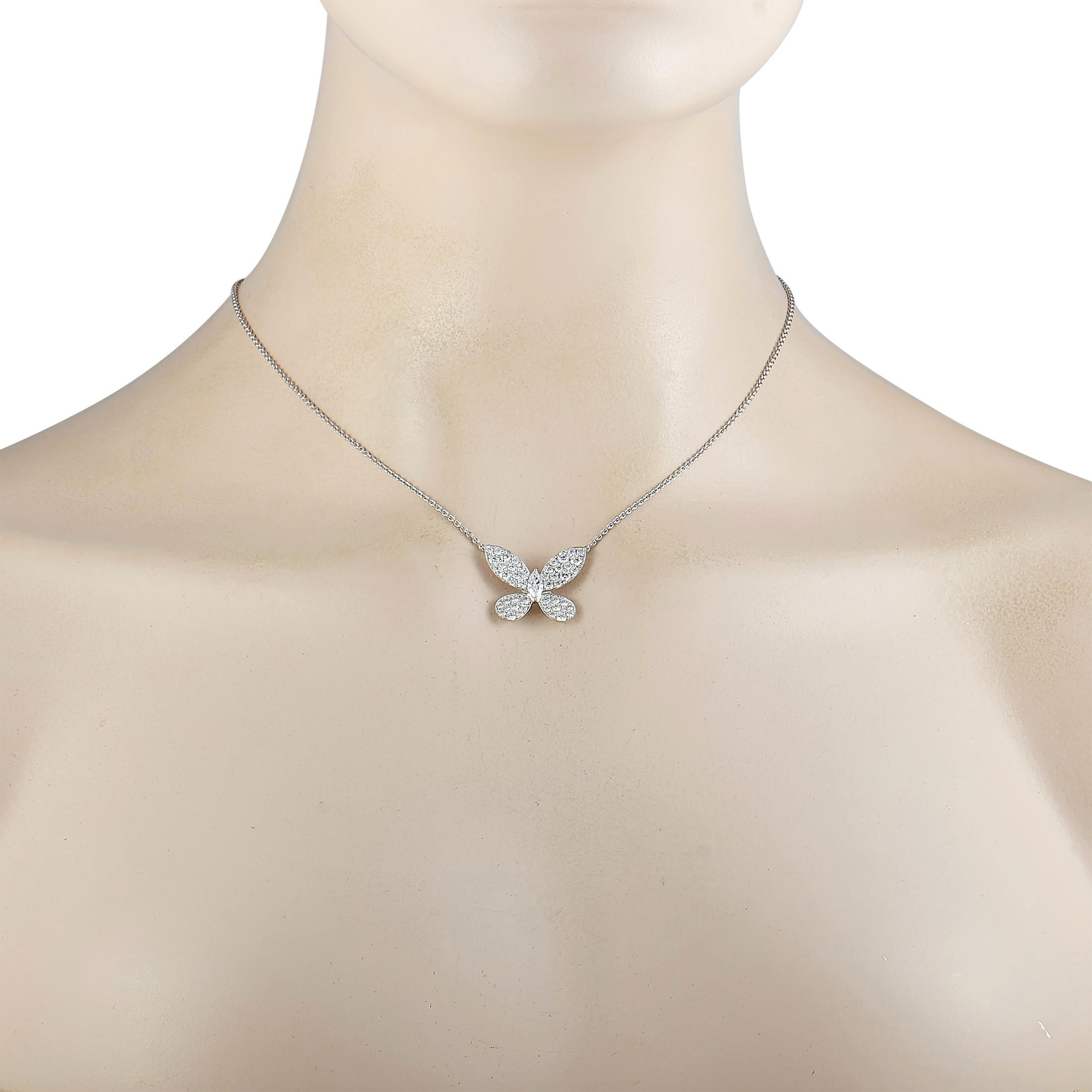 This Graff necklace is made of 18K white gold and presented with a 16” chain onto which a diamond-embellished butterfly pendant is attached, measuring 0.75” in length and 1” in width. The center, marquise diamond stone weighs 0.30 carats and the