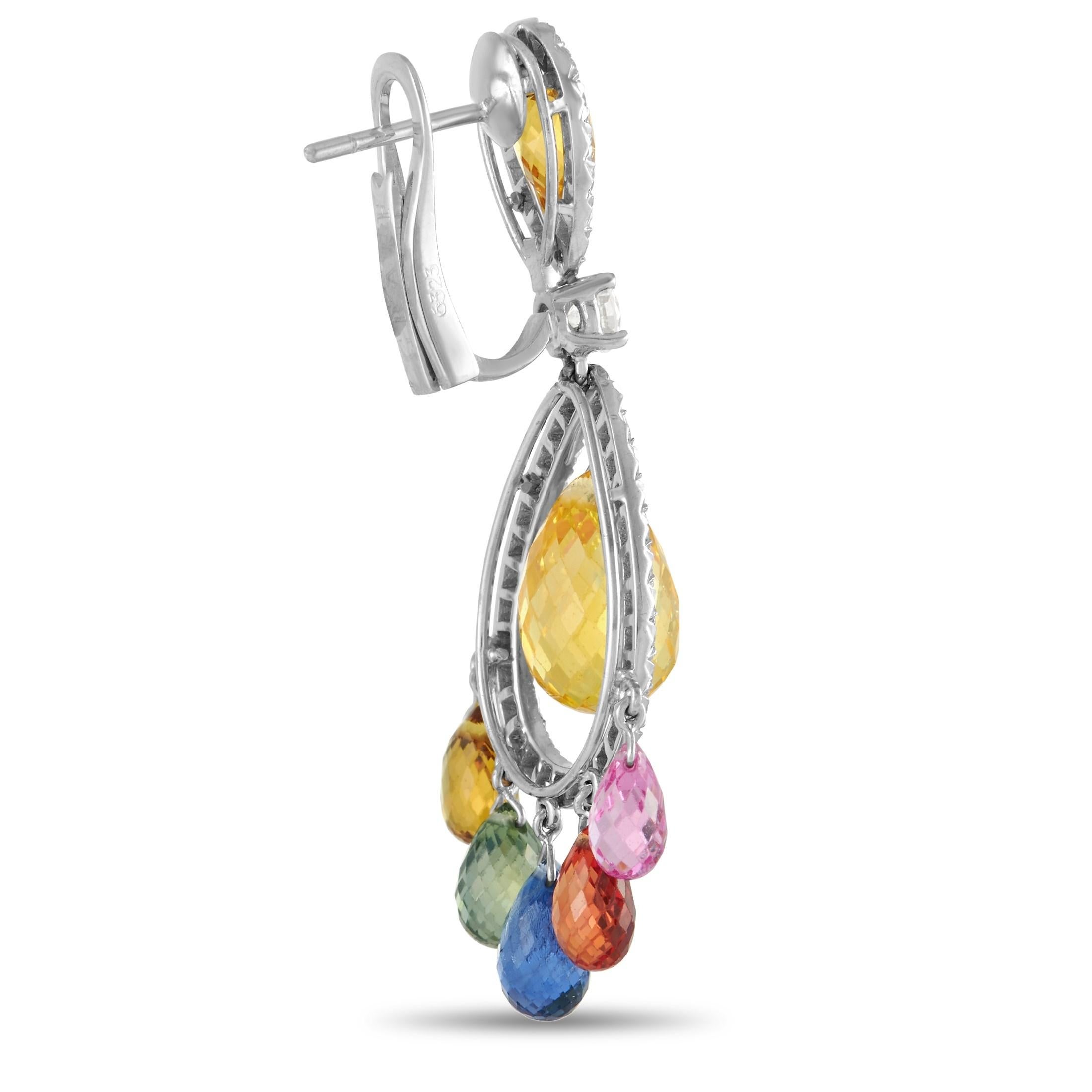 These pretty Graff dangle earrings are full of color. Each earring is crafted from 18K white gold and set with an estimated 1.20 carats of brilliant round diamonds of F color and VVS clarity throughout. The earrings are also set with an estimated