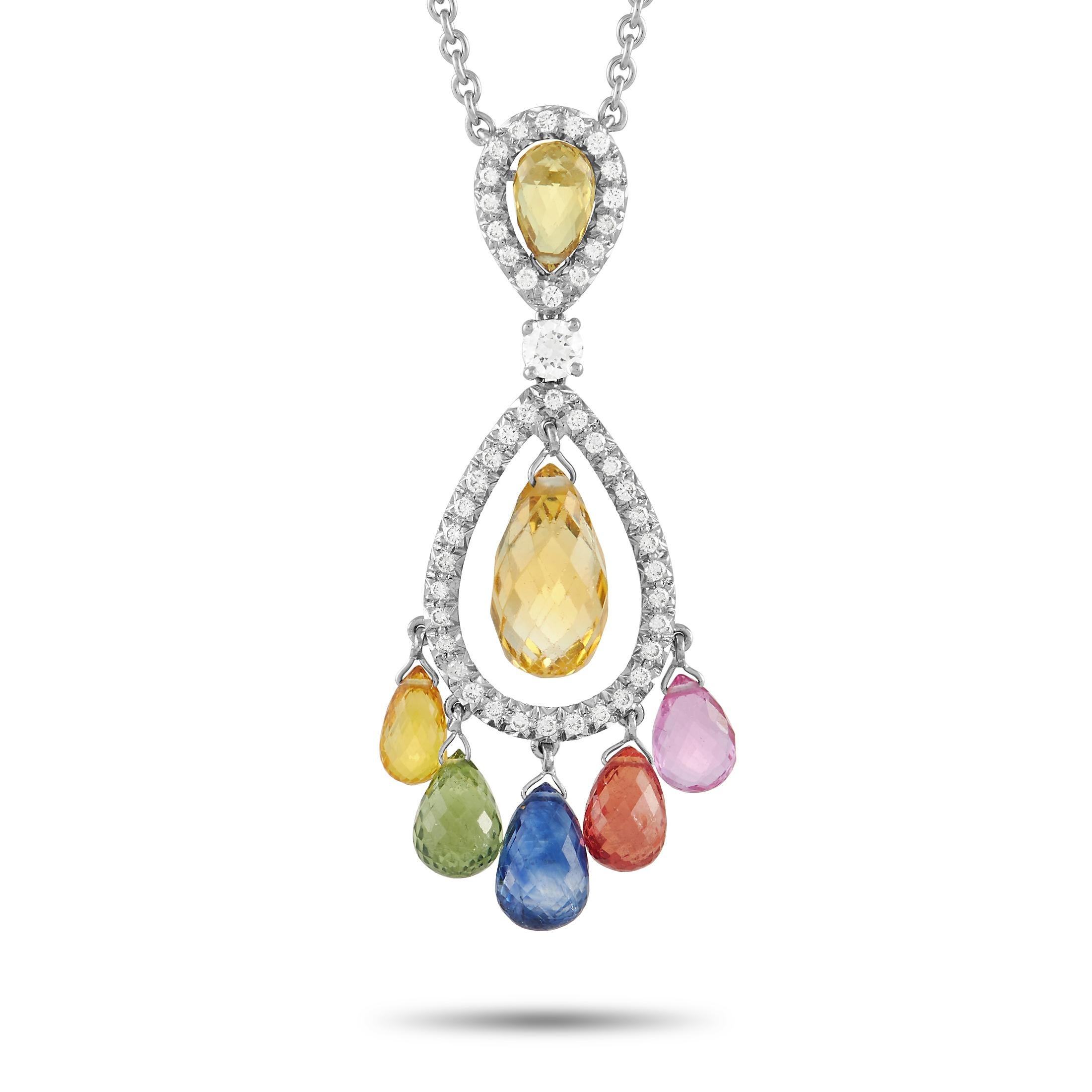 This vibrant Graff necklace and earring set is full of personality. The necklace pendant is made from 18K white gold and set with an estimated 1.75 carats of brilliant round diamonds over its face outlining an estimated 6.50 carats of multi-colored