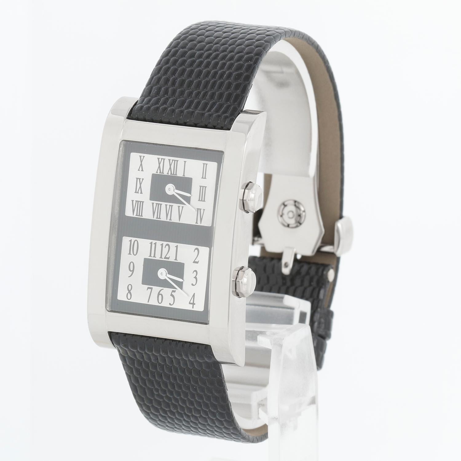 Graff 18K White gold Dual Time Zone Quartz Watch - Quartz. 18K White gold (26 mm x 42mm). Silver Dial with dual time zone with Roman numerals and Arabic numerals. Black Strap with Graff White gold deployant clasp. Pre-owned with custom box.