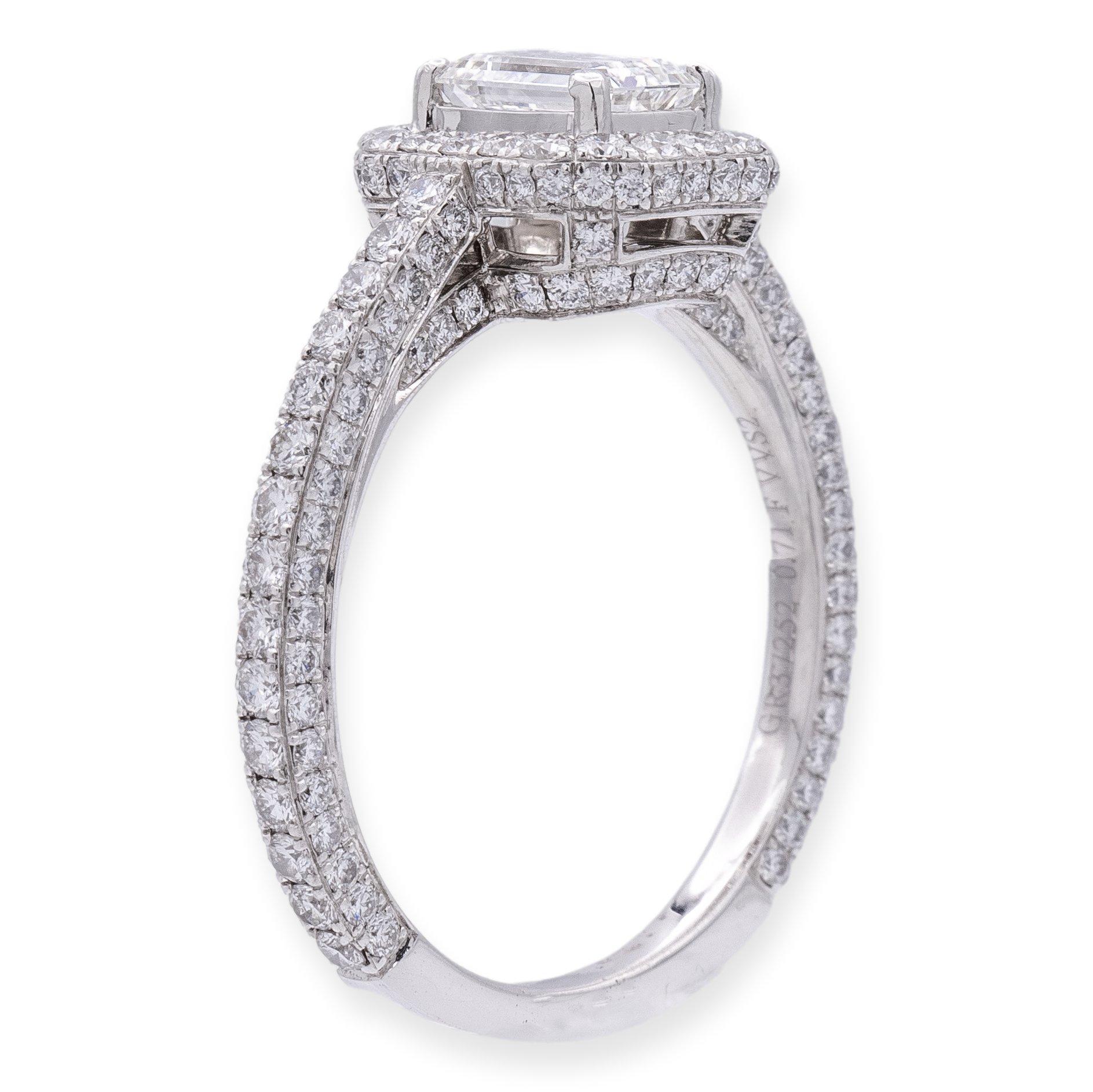 Graff diamond engagement ring from the Constellation collection. Meticulously fashioned from 18k white gold, this ring showcases a central .71 carat emerald cut diamond of impeccable F color and VS1 clarity, certified by the Gemological Institute of
