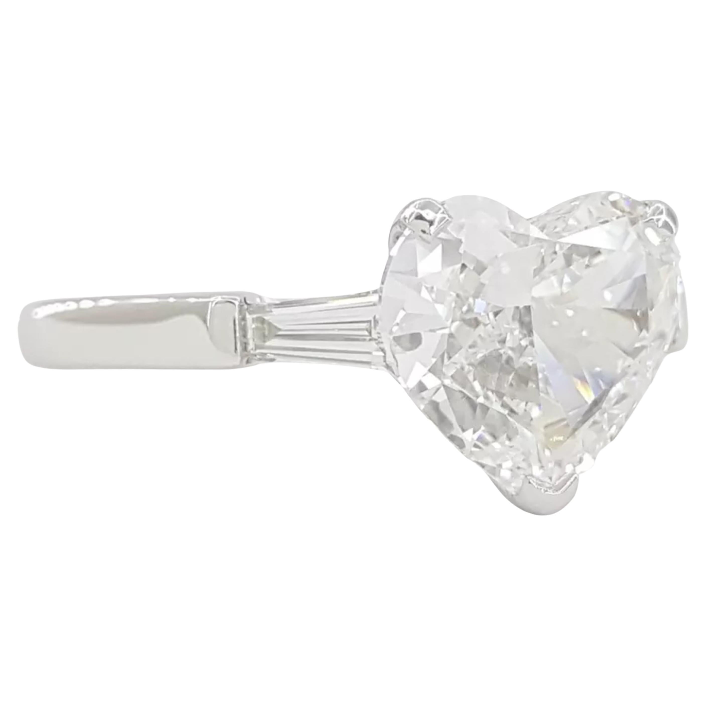  Graff 2.24 ct Three-Stone Diamond Engagement Ring in Platinum

Discover timeless elegance with this stunning Graff three-stone engagement ring, expertly crafted in platinum. Featuring a magnificent 2.00 ct heart brilliant cut diamond at its center,
