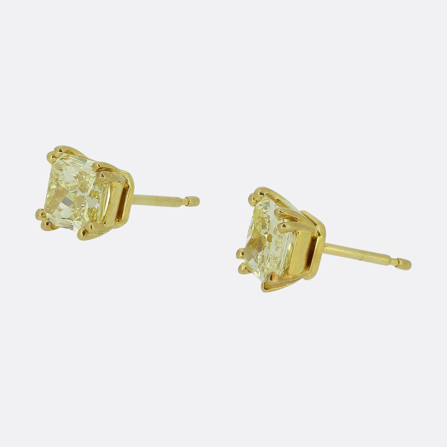 Here we have a fabulous pair of stud earrings from the world renowned luxury jewellery house of Graff. Each piece features a radiant natural fancy yellow rectangular diamond meticulously set in a secure four-pronged setting. The diamonds exhibit a