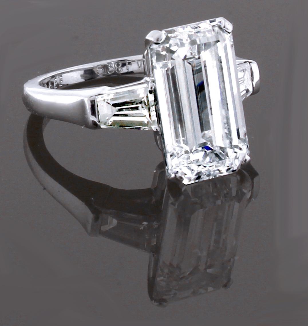 From Graff a  striking and timeless emerald cut diamond ring featuring a remarkable 5.38 carat F, VVS2 diamond. Its sleek, architectural setting featuring baguette cut shoulder diamonds weighing .75 carats complements the strong and sharp lines of