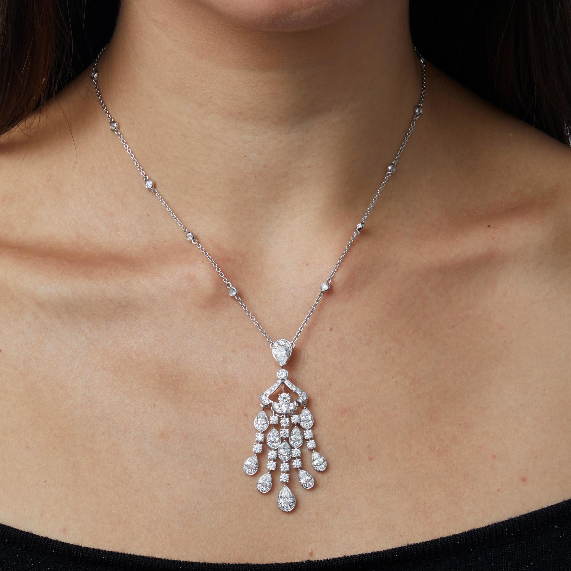 An incredible diamond necklace by Graff showcasing a .70ct pear shaped diamond followed by cascading fringes adorned with the finest round and pear shaped diamonds set in 18k white gold. 

The necklace measures 16 1/2