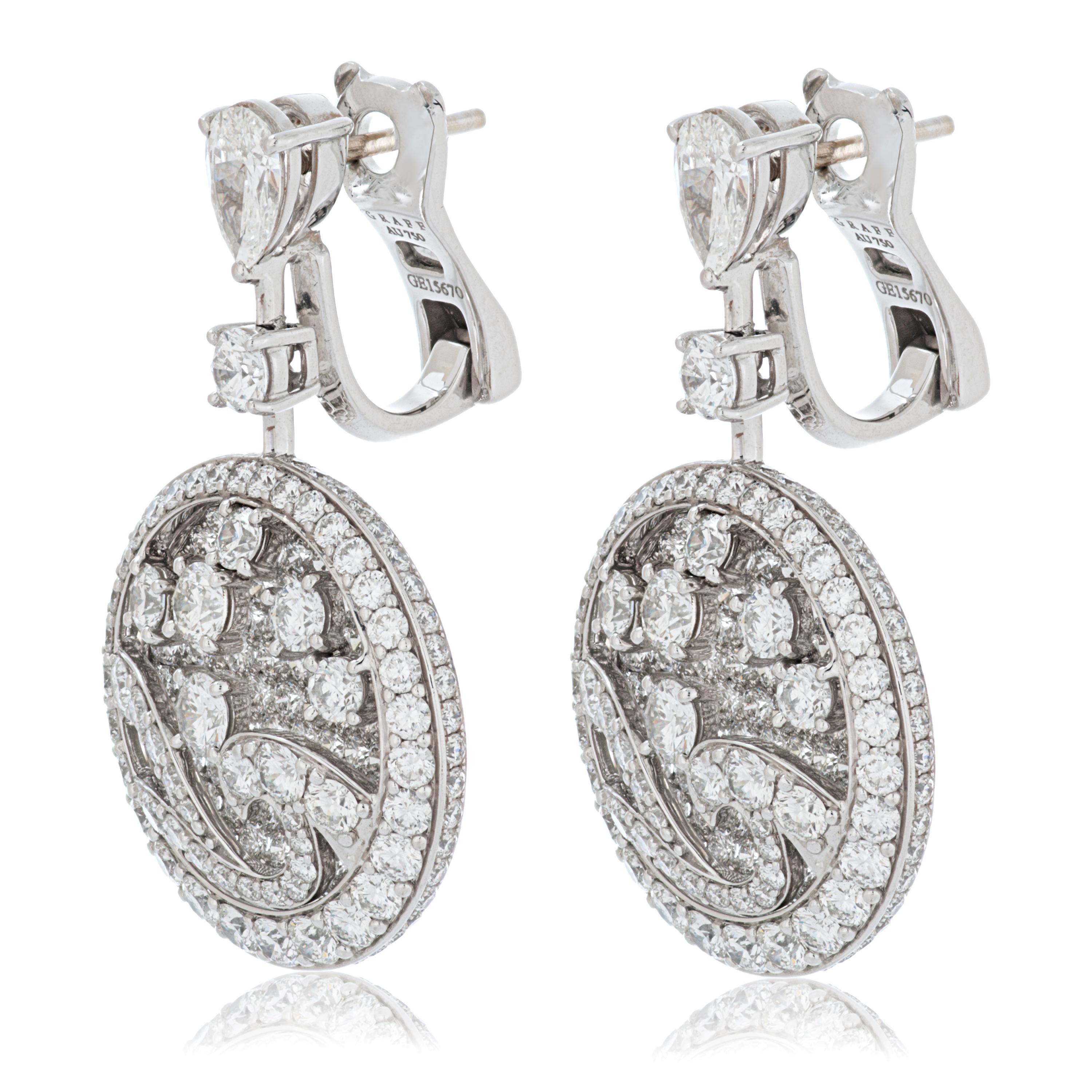 Graff diamond wave earrings in 18k white gold accompanied by Graff box.

These earrings feature a two pear shape diamonds as well as 390 round brilliant cut diamonds totaling approximately 9.93 carats of fine white diamonds with VS+ clarity, all set